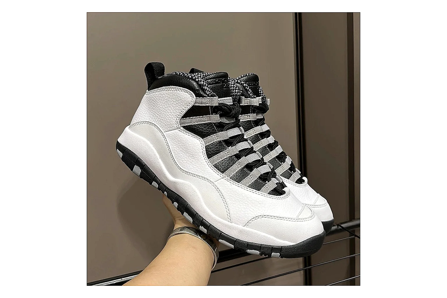 Jordan Air Jordan 10 Steel White Black QC reference photo showing white and black high-top court upper, striped lace panels, Jumpman heel branding, and retro sole thumbnail 6