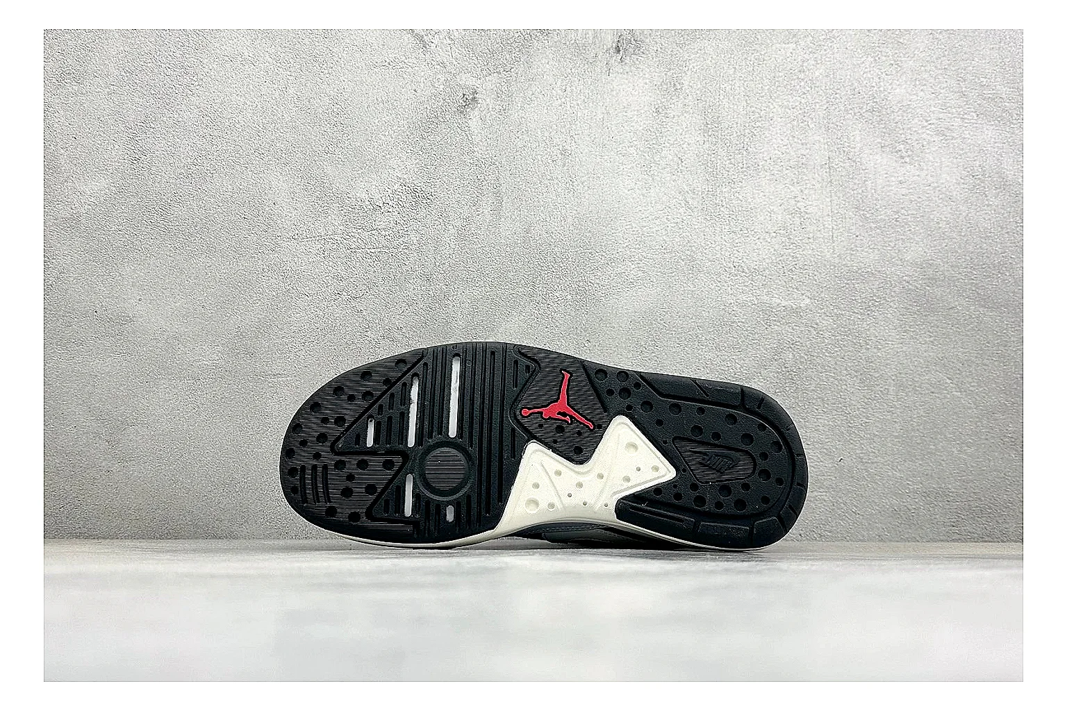 Jordan CMFT Black White QC reference photo showing black and white layered panels, low padded collar, visible Jordan styling cues, and a compact court sole thumbnail 3