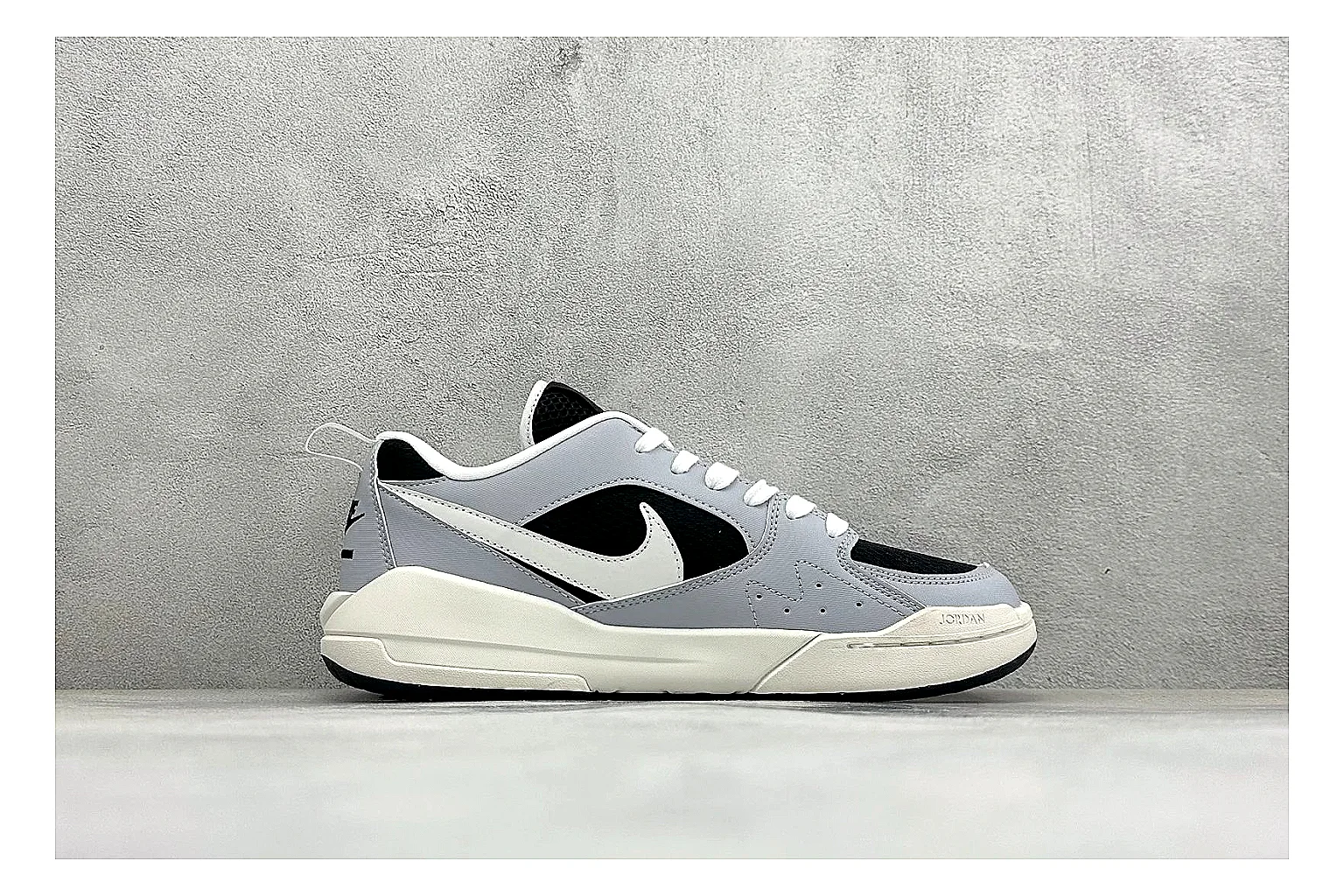 Jordan CMFT Black White QC reference photo showing black and white layered panels, low padded collar, visible Jordan styling cues, and a compact court sole thumbnail 5