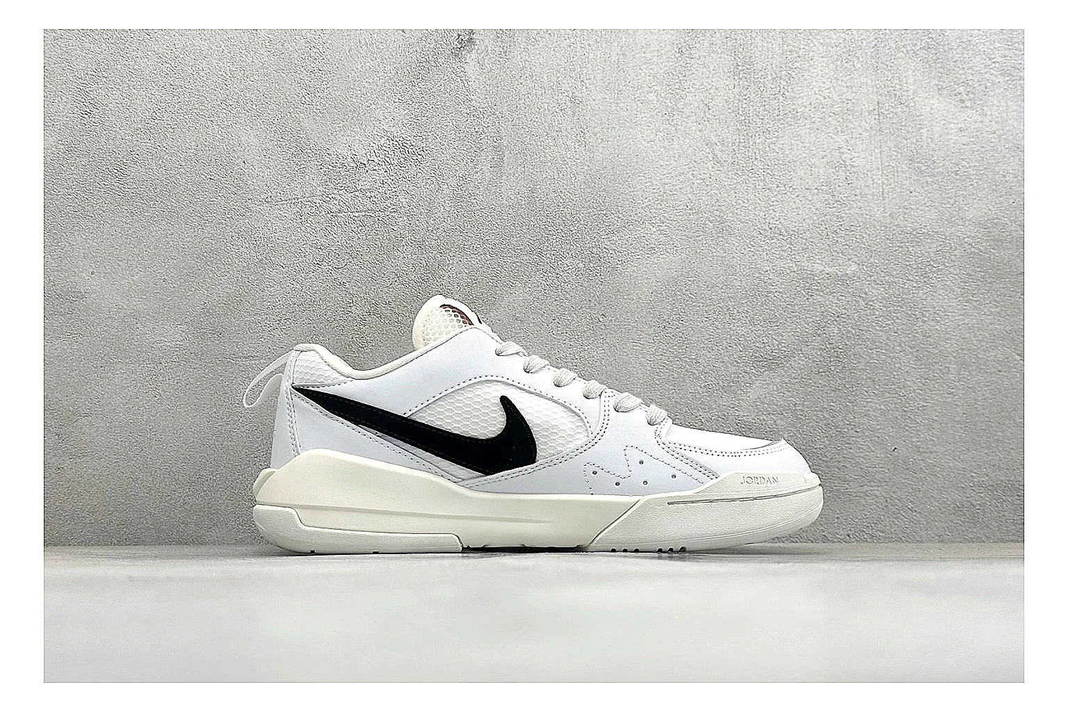 Jordan CMFT White Black QC reference photo showing white and black layered court panels, red logo detail, low collar, and a clean contrast sole thumbnail 5
