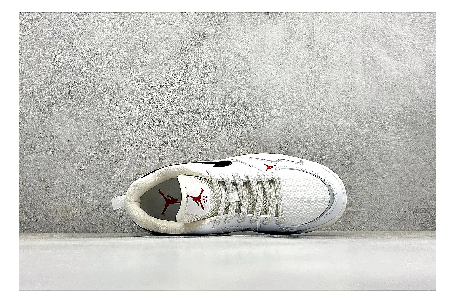 Jordan CMFT White Black QC reference photo showing white and black layered court panels, red logo detail, low collar, and a clean contrast sole thumbnail 6