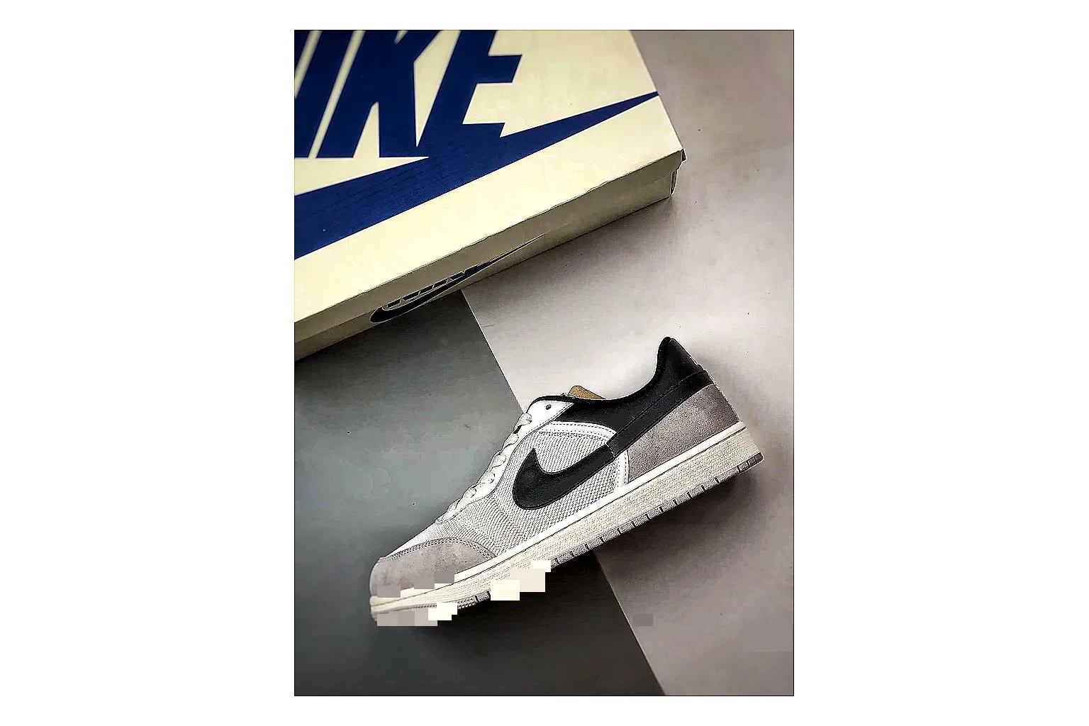 Jordan Low Black White Sneaker QC photo showing white black low-top sneaker with mixed-material upper and low-profile shape