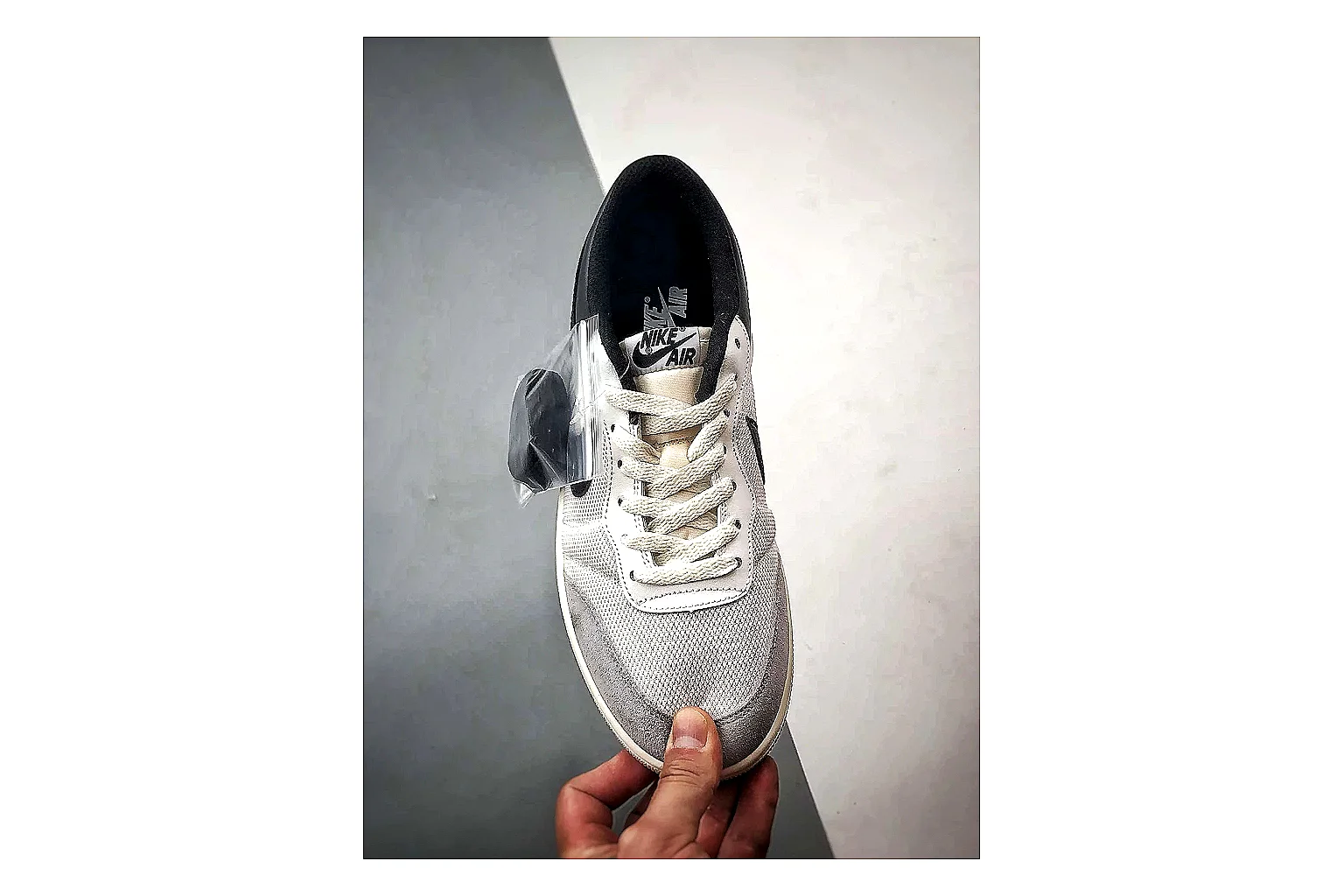 Jordan Low Black White Sneaker QC photo showing white black low-top sneaker with mixed-material upper and low-profile shape thumbnail 6