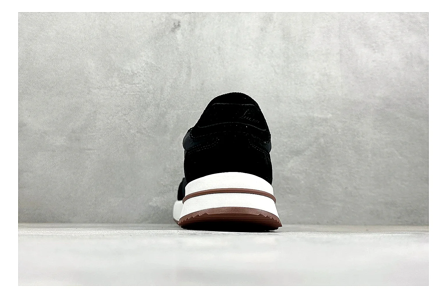Loro Piana Week-End Black QC reference image showing black suede upper, low casual profile, striped midsole accent, and soft everyday shape