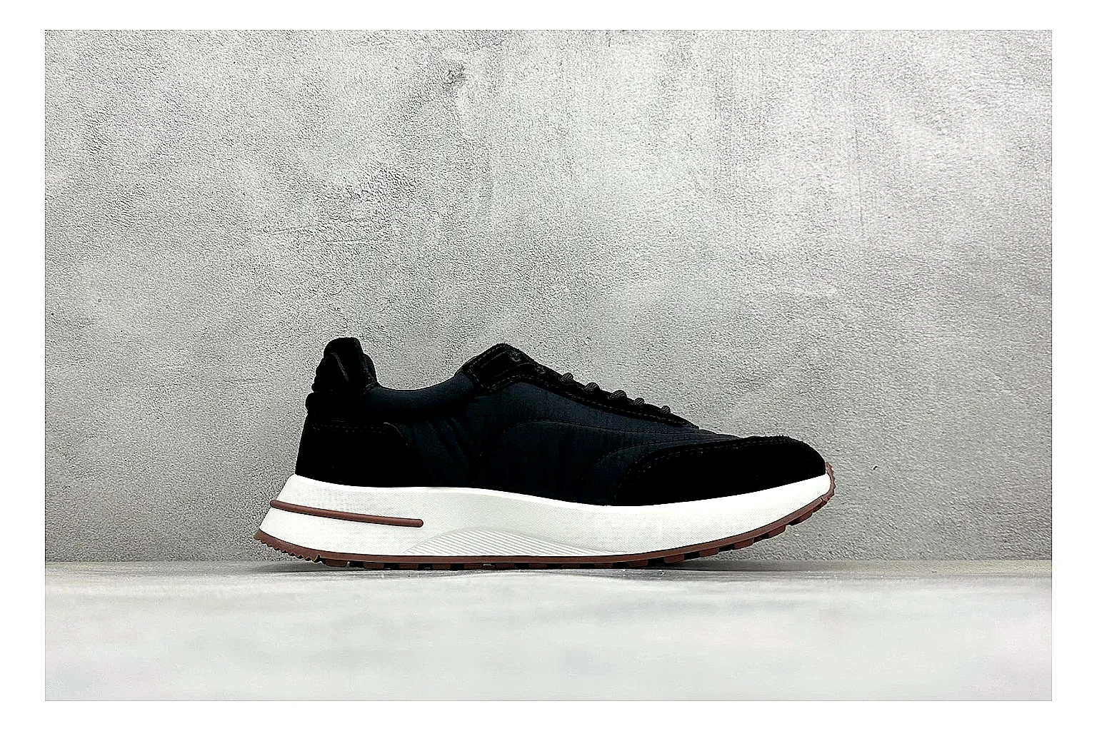 Loro Piana Week-End Black QC reference image showing black suede upper, low casual profile, striped midsole accent, and soft everyday shape thumbnail 5