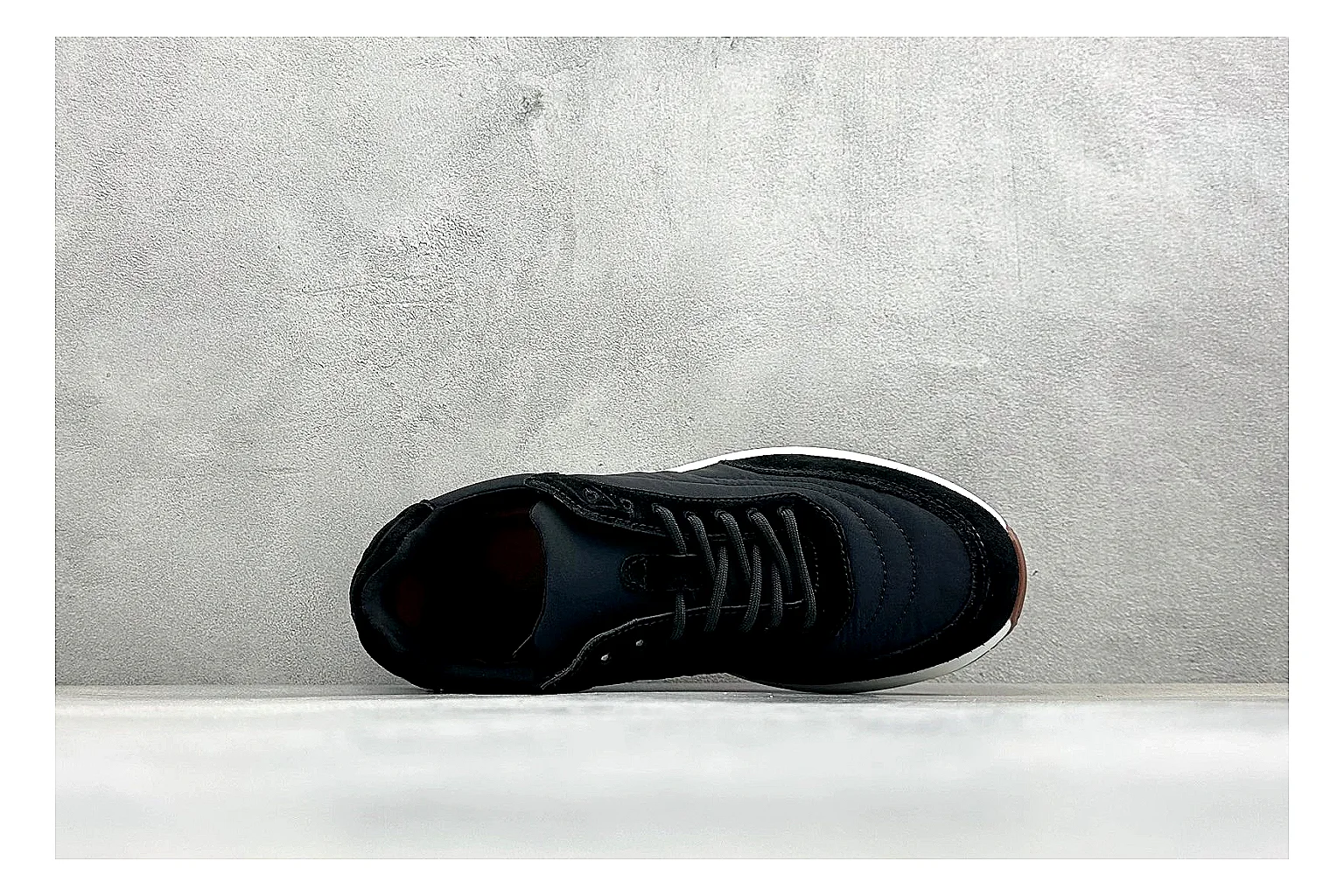 Loro Piana Week-End Black QC reference image showing black suede upper, low casual profile, striped midsole accent, and soft everyday shape thumbnail 6