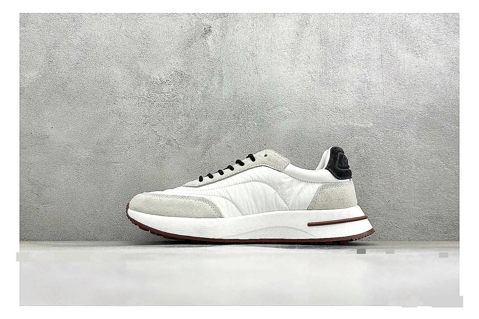 Loro Piana Week-End White QC reference image showing white leather upper, gum outsole, low clean profile, and restrained casual detailing