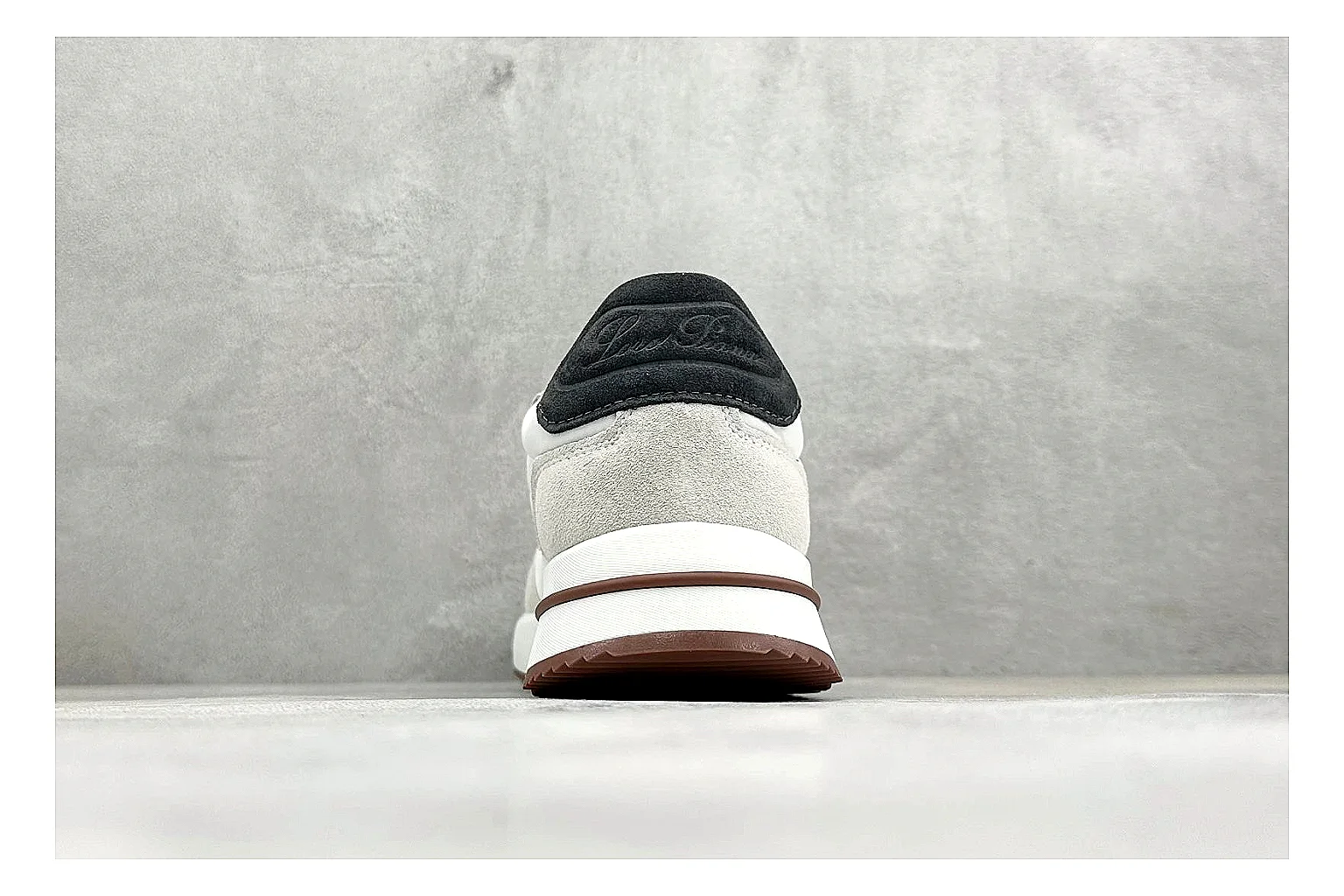 Loro Piana Week-End White QC reference image showing white leather upper, gum outsole, low clean profile, and restrained casual detailing