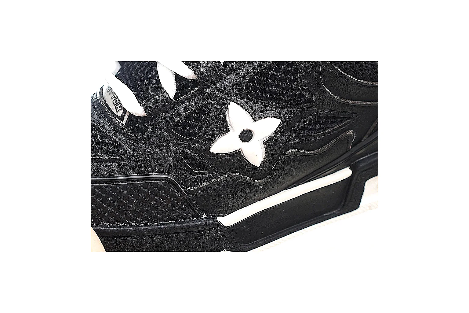 Louis Vuitton 0771 black trainer QC closeup for side badge and mesh checks thumbnail 4