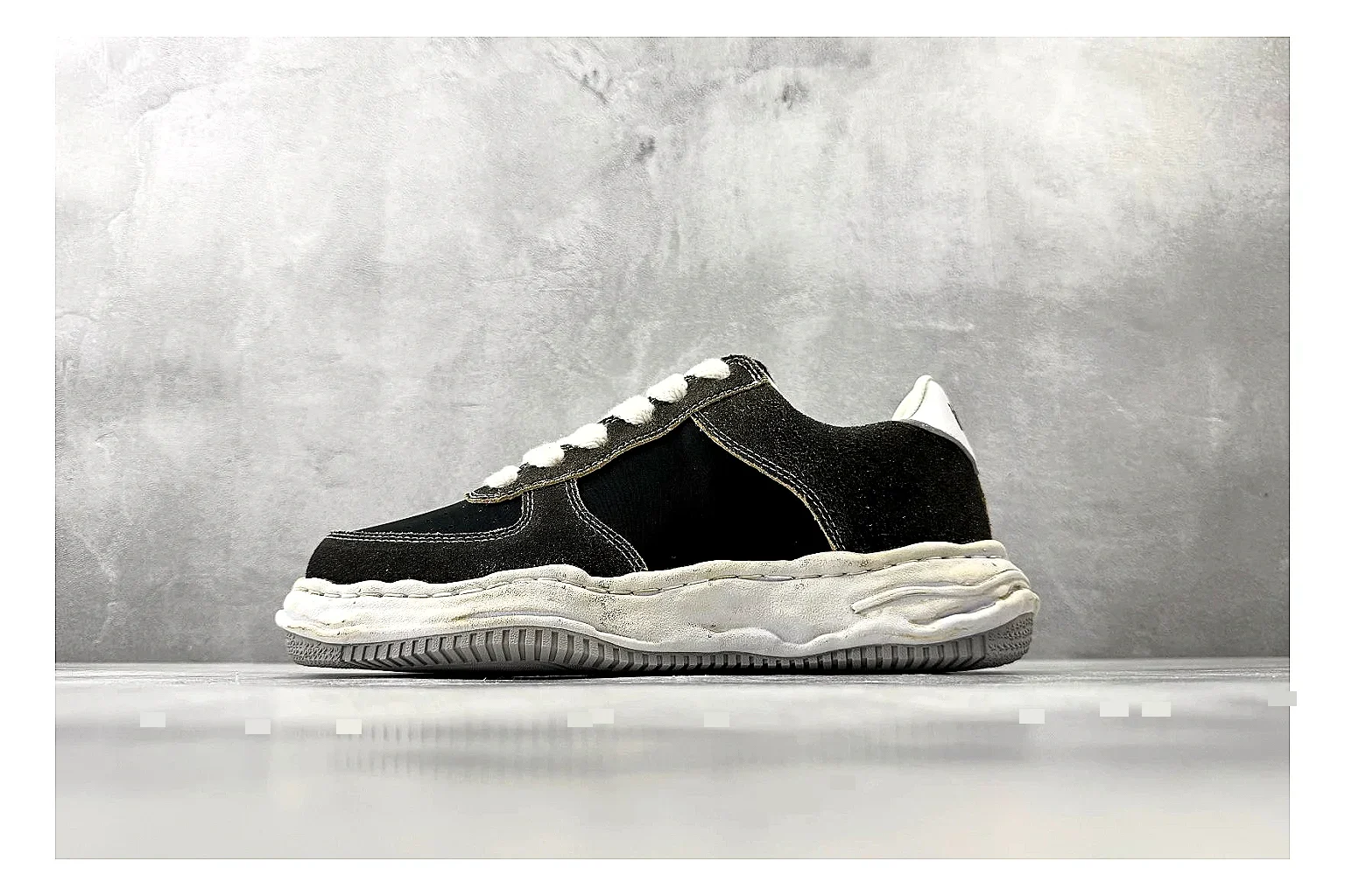 Maison Mihara Yasuhiro Blakey Black Distressed QC reference photo showing black distressed canvas upper, warped sculpted white sole, low lace profile, and worn texture