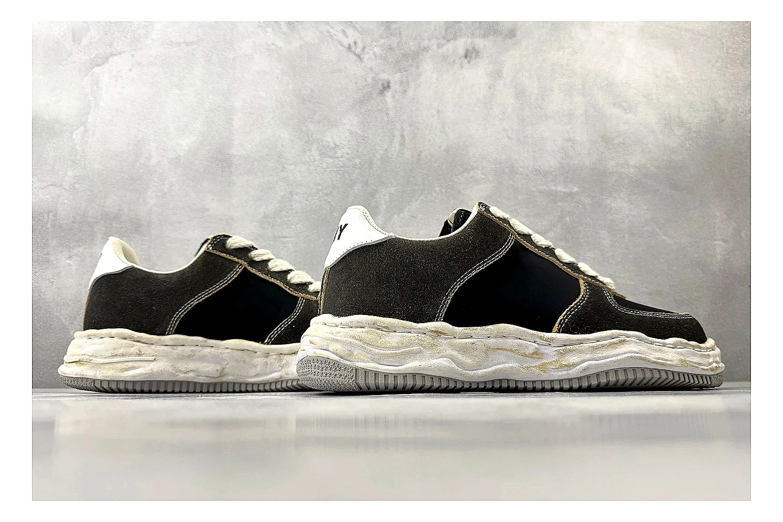 Maison Mihara Yasuhiro Blakey Black Distressed QC reference photo showing black distressed canvas upper, warped sculpted white sole, low lace profile, and worn texture