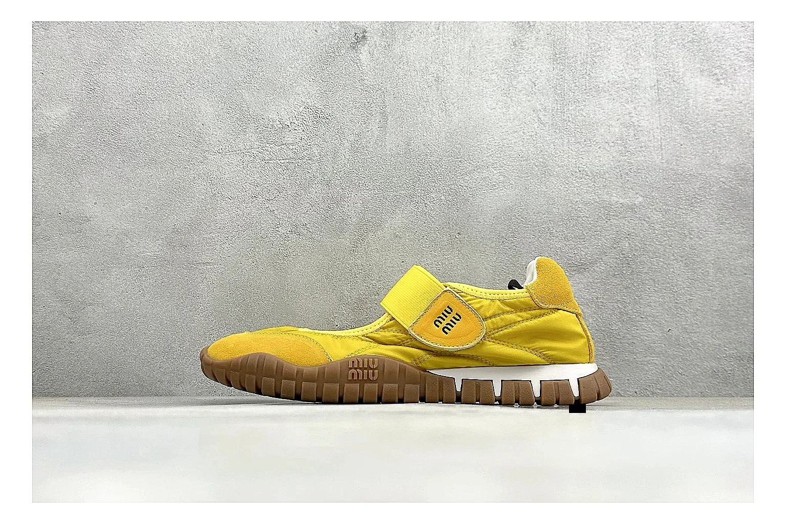 Miu Miu Tyre Yellow Mary Jane QC reference photo showing yellow Mary Jane upper, strap closure, rugged Tyre outsole, and playful low-profile shape