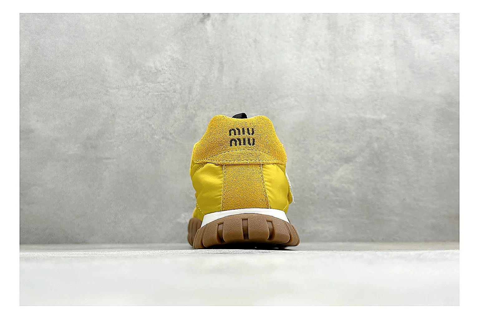 Miu Miu Tyre Yellow Mary Jane QC reference photo showing yellow Mary Jane upper, strap closure, rugged Tyre outsole, and playful low-profile shape