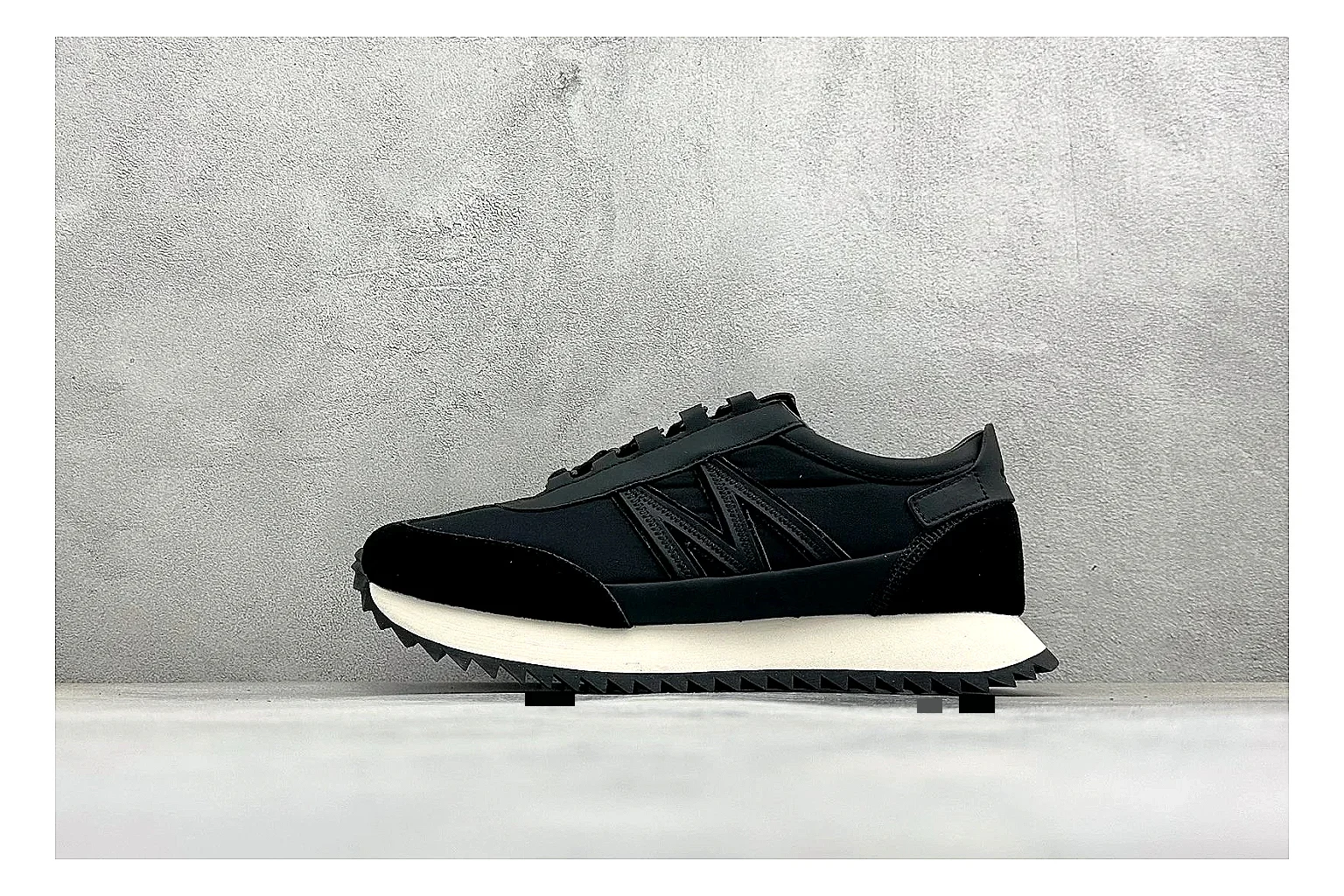Moncler Pacey Black White QC reference image showing black upper, white rugged outsole, low padded collar, and outdoor-leaning tread profile