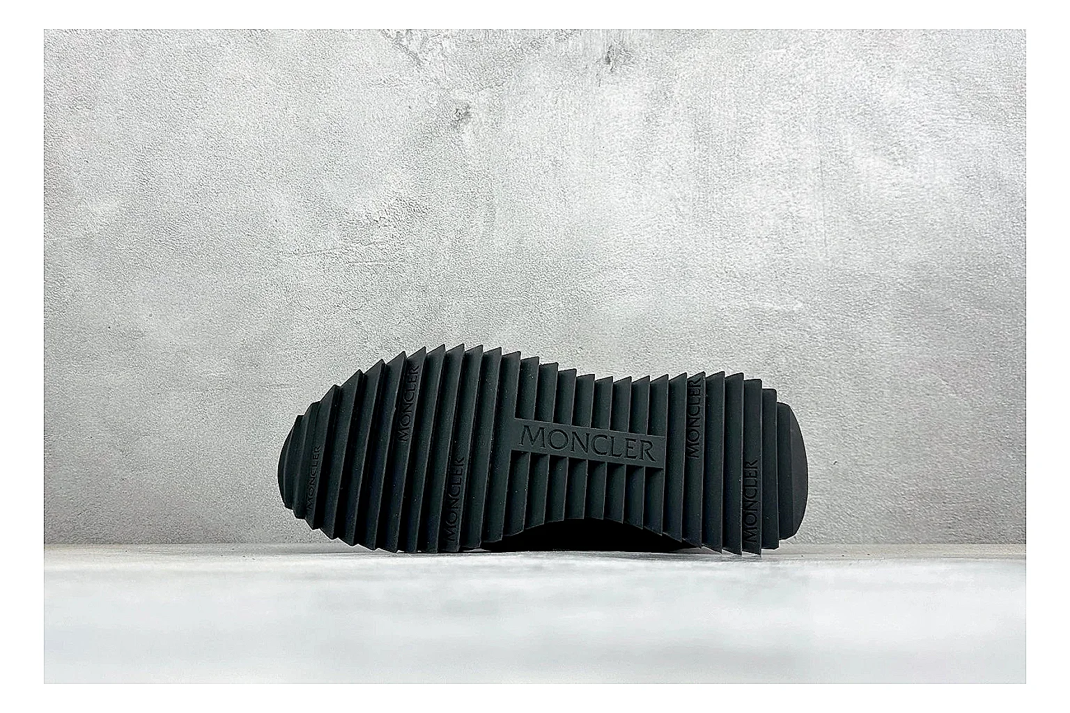 Moncler Pacey Black White QC reference image showing black upper, white rugged outsole, low padded collar, and outdoor-leaning tread profile thumbnail 3