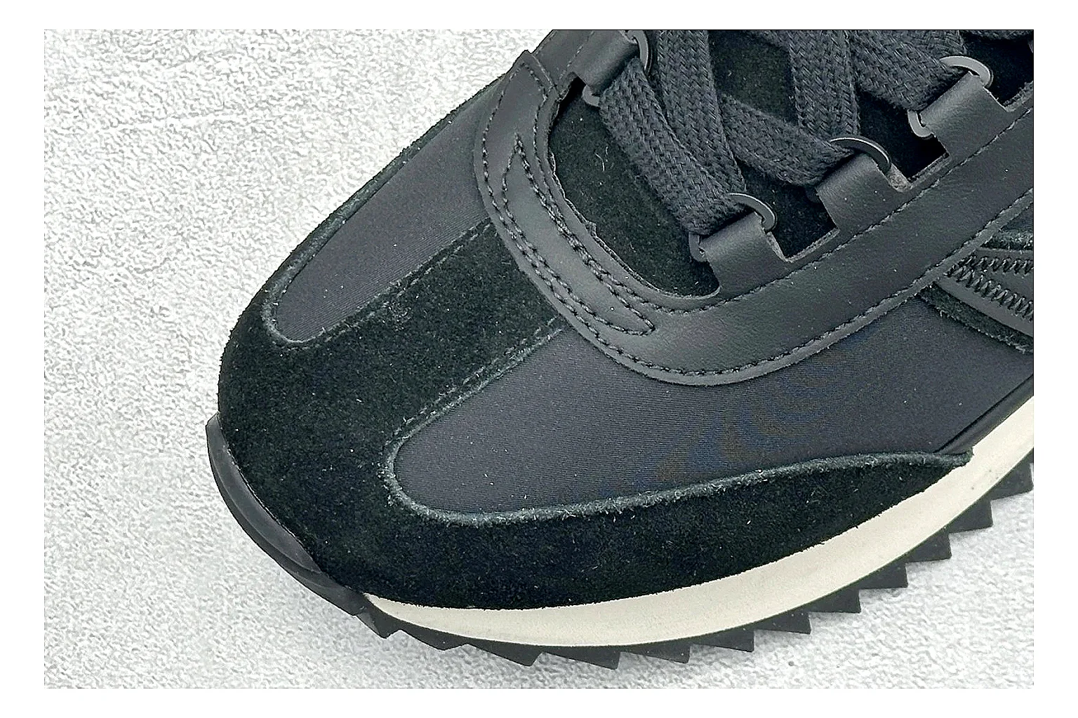 Moncler Pacey Black White QC reference image showing black upper, white rugged outsole, low padded collar, and outdoor-leaning tread profile thumbnail 4