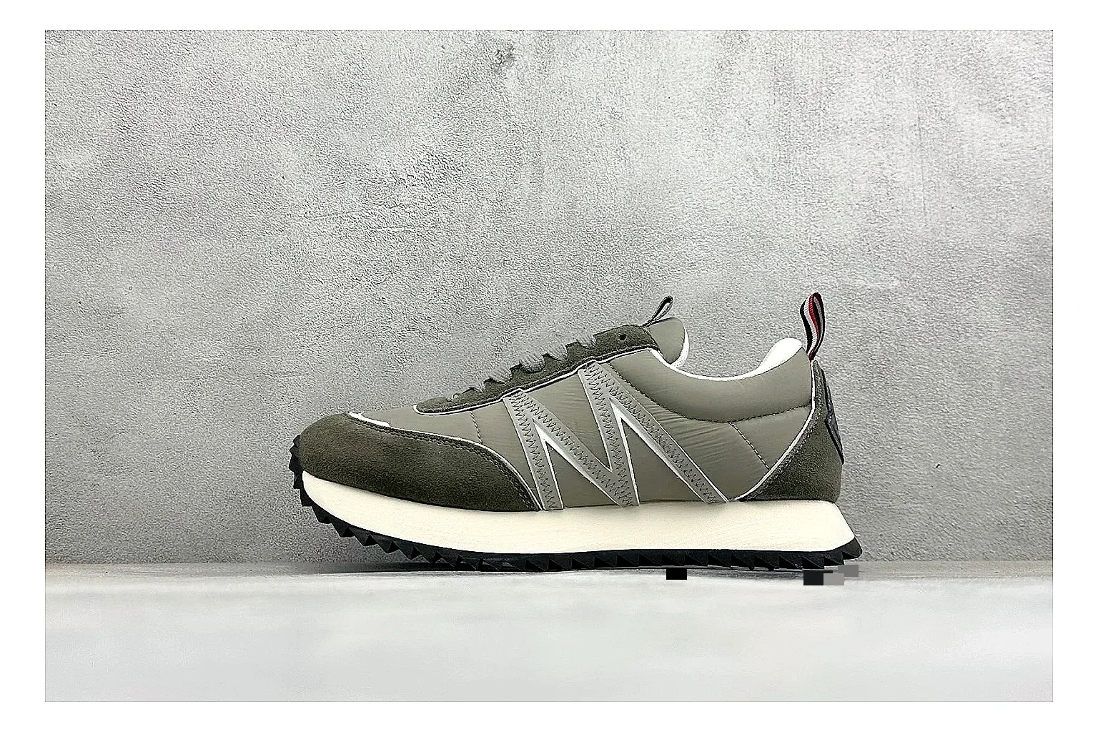 Moncler Pacey Grey Suede QC reference image showing grey suede upper, rugged white outsole, low collar, and soft neutral streetwear tone