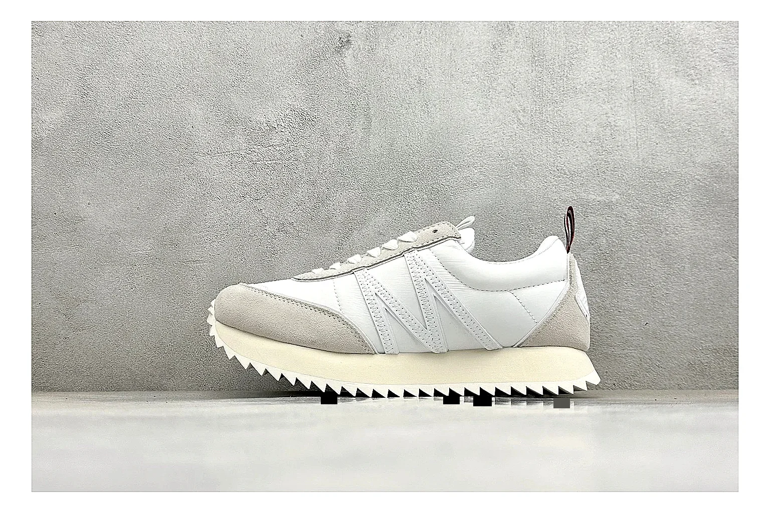 Moncler Pacey White Suede QC reference image showing light suede upper, chunky serrated outsole, low padded collar, and tonal casual build