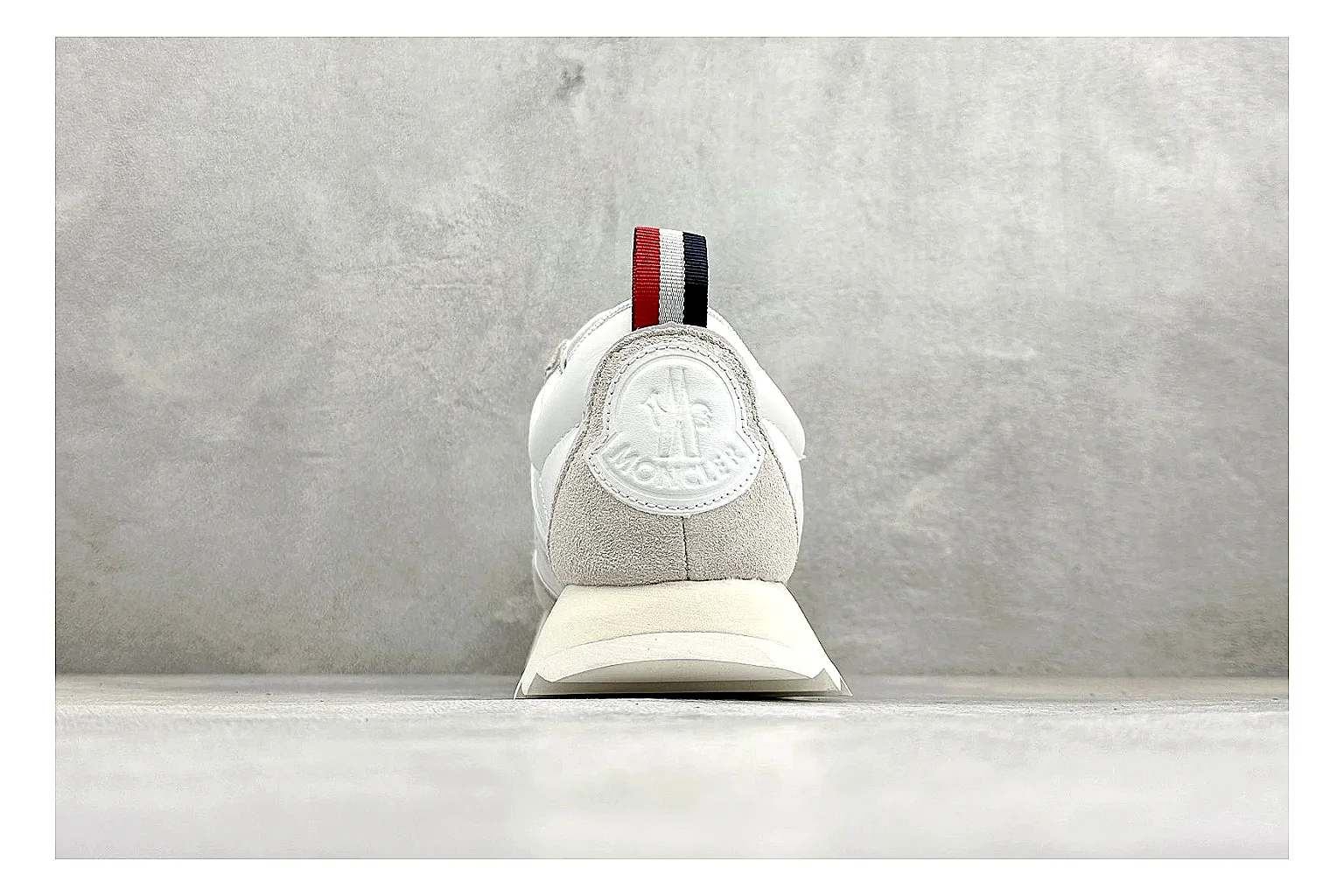 Moncler Pacey White Suede QC reference image showing light suede upper, chunky serrated outsole, low padded collar, and tonal casual build