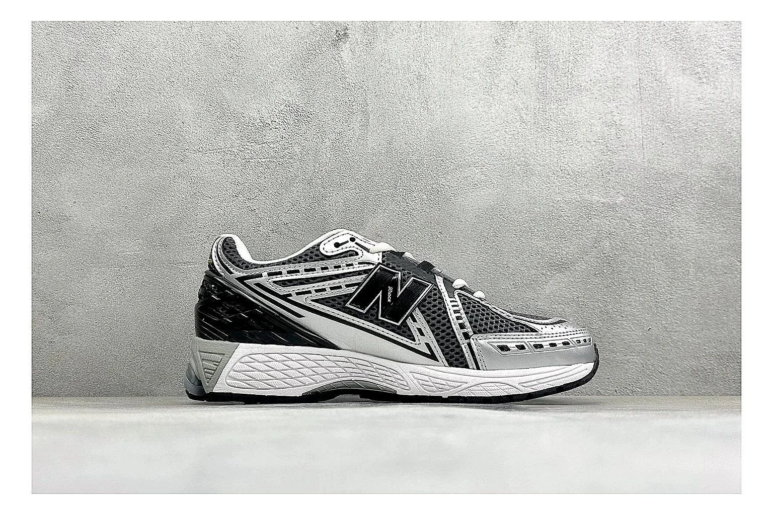 New Balance 1906 Black Silver QC reference photo showing black mesh base, silver overlays, technical 1906 runner structure, and layered performance sole thumbnail 5
