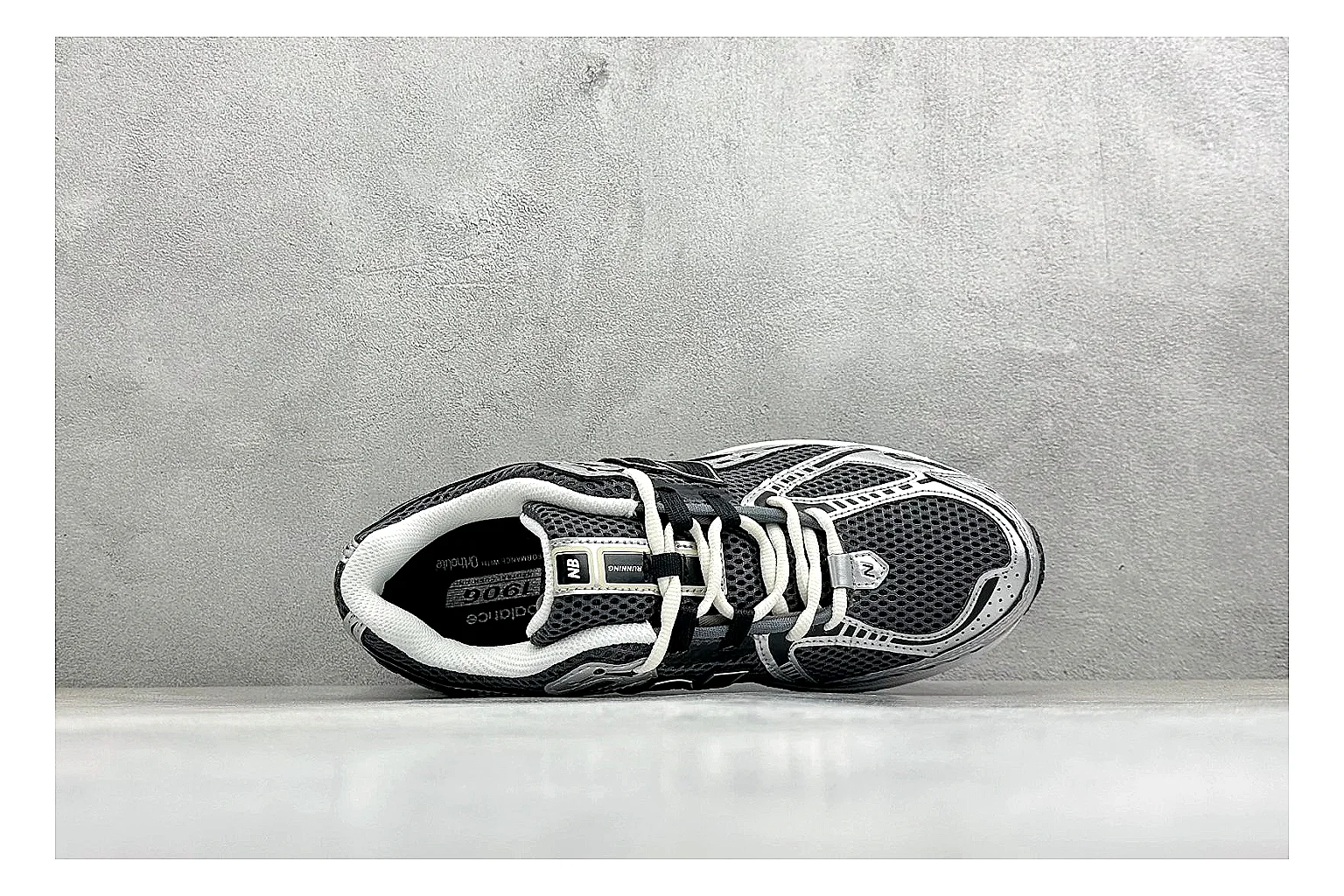 New Balance 1906 Black Silver QC reference photo showing black mesh base, silver overlays, technical 1906 runner structure, and layered performance sole thumbnail 6