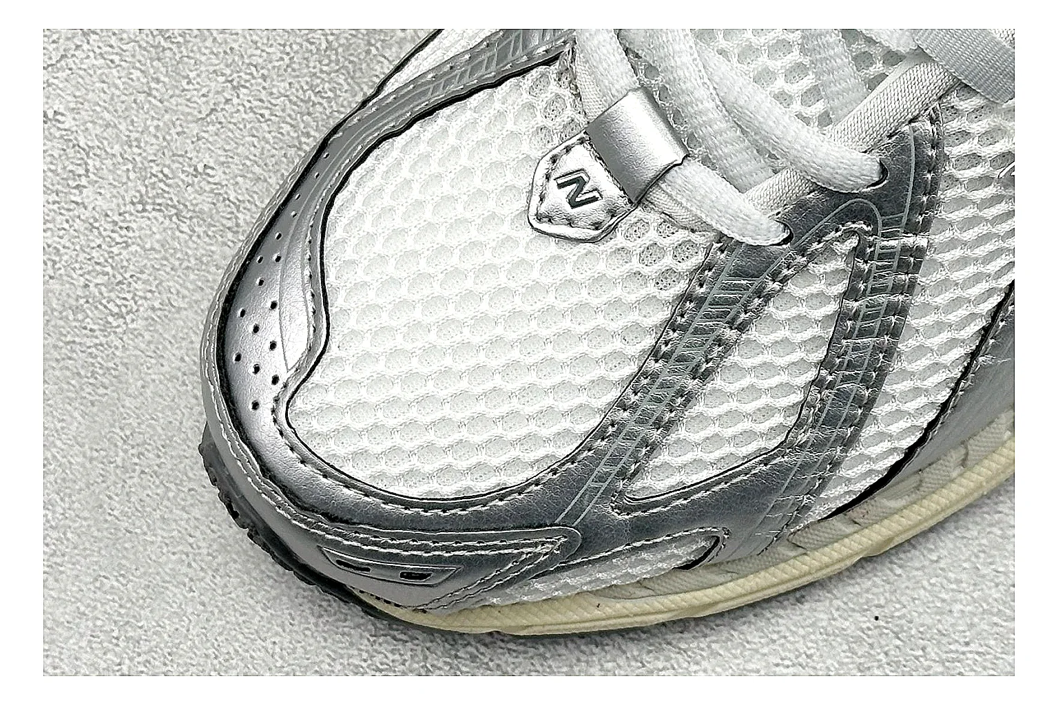 New Balance 1906 Silver Grey QC reference image showing silver overlays, grey mesh panels, technical runner structure, and layered midsole tooling thumbnail 4