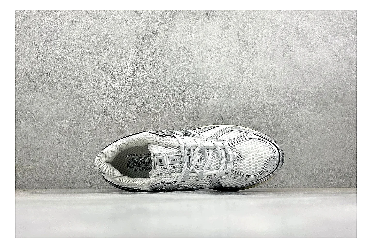 New Balance 1906 Silver Grey QC reference image showing silver overlays, grey mesh panels, technical runner structure, and layered midsole tooling thumbnail 6