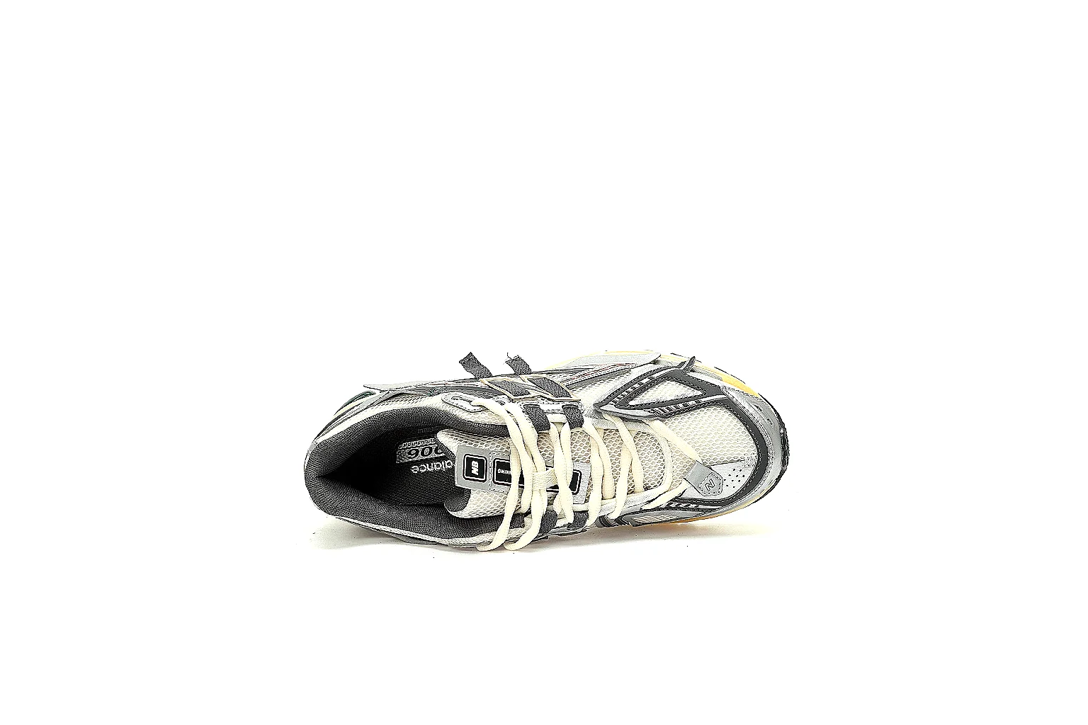 New Balance 1906R side profile showing logo, mesh, overlays and midsole QC points