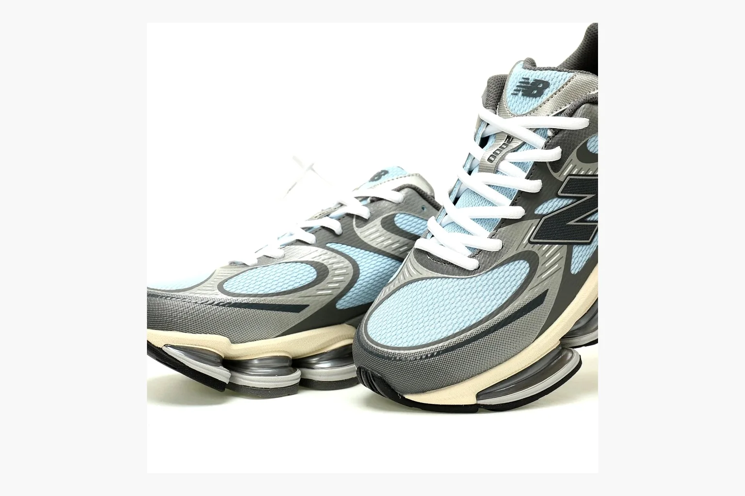 New Balance 9060 Runner Sneaker Silver Teal QC photo showing silver and teal NB 9060 runner with chunky sole, mesh panels, and side N logo thumbnail 4