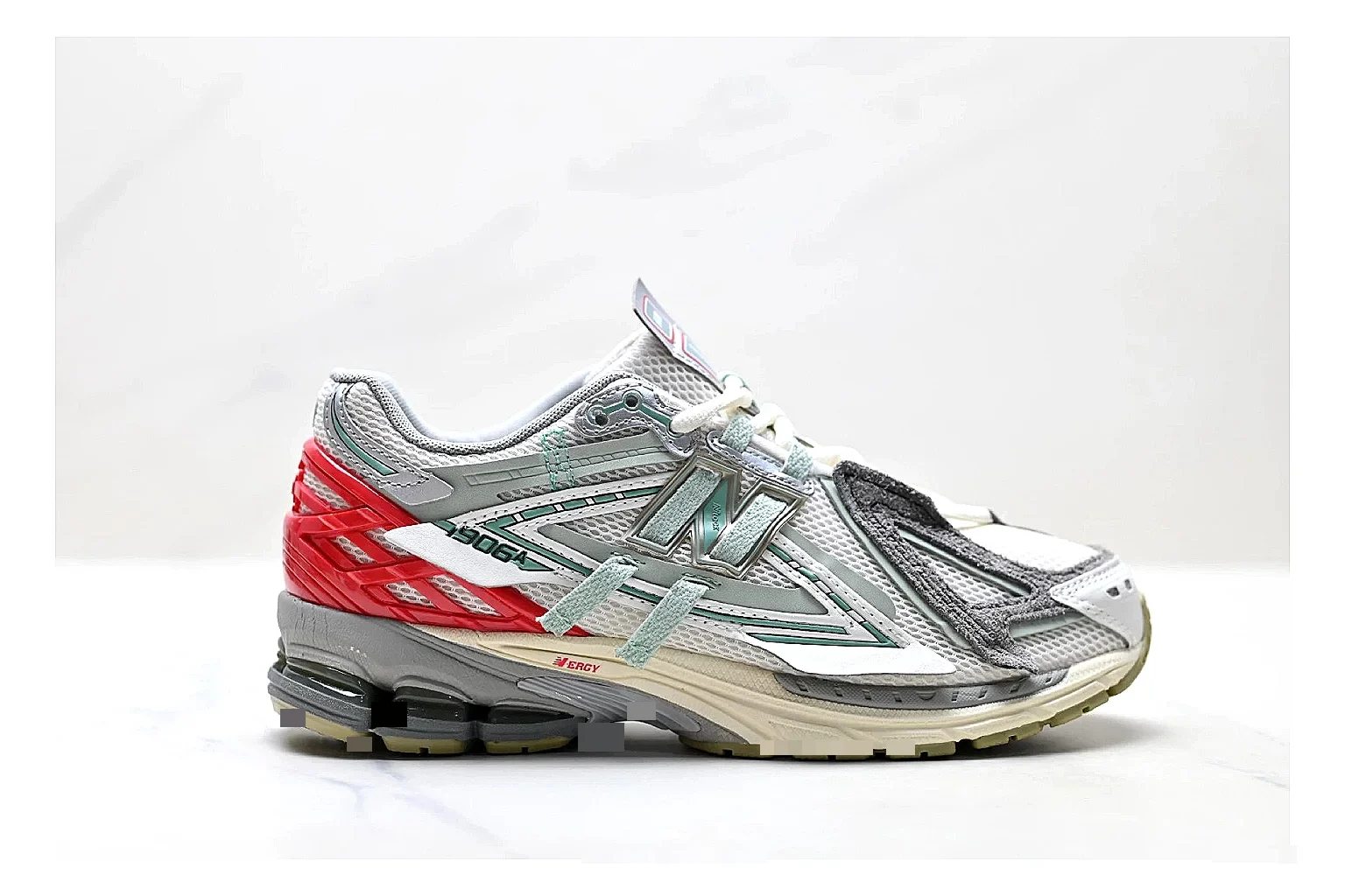 New Balance M1906 Silver Red Sneakers QC photo reference showing silver red retro runner sneakers with mesh-leather texture, side-profile shape, upper panel lines, and outsole detail