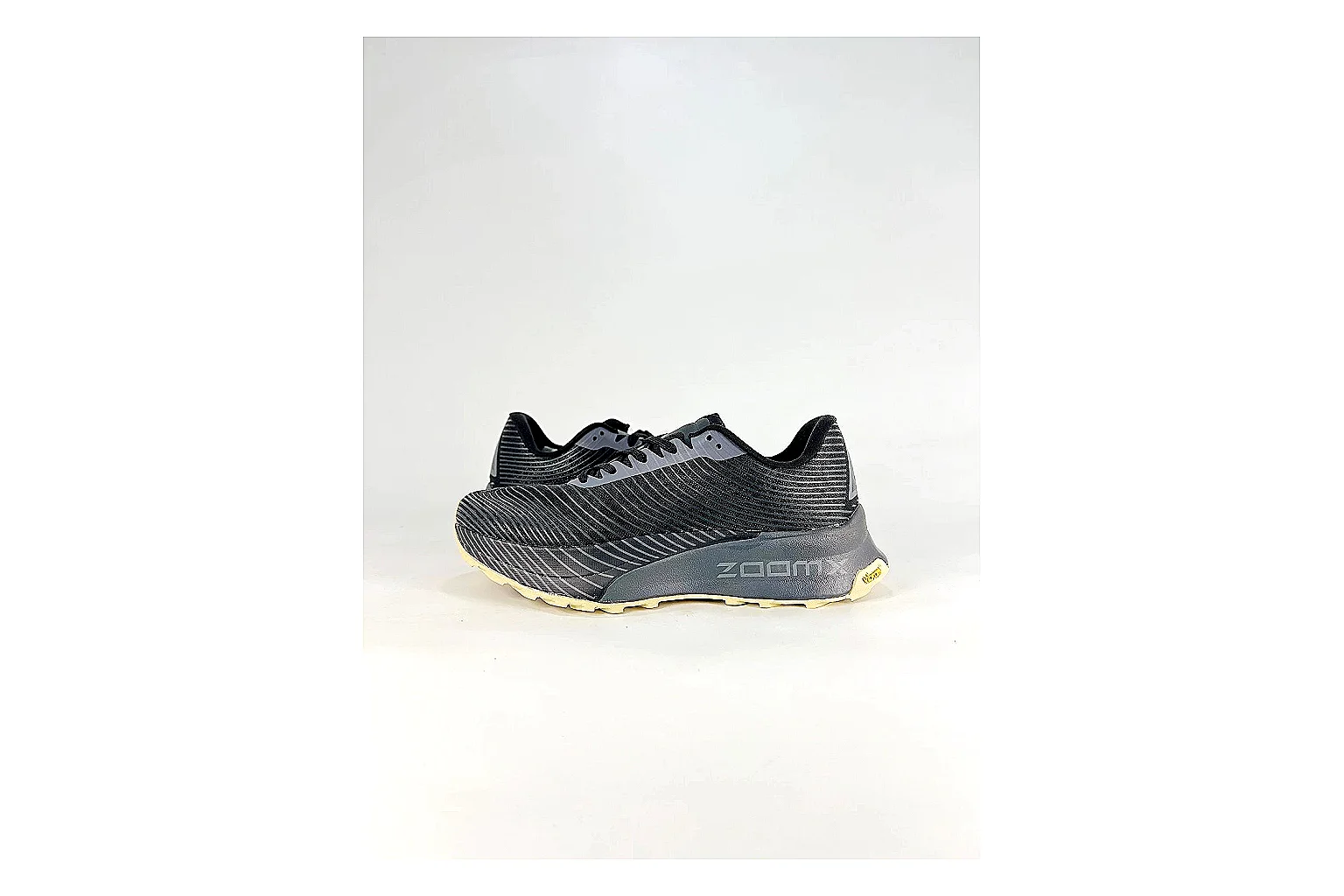 Nike ACG Ultra Black Gum Sneakers QC photo reference showing black gum outdoor sneakers with textile texture, side-profile shape, upper panel lines, and outsole detail
