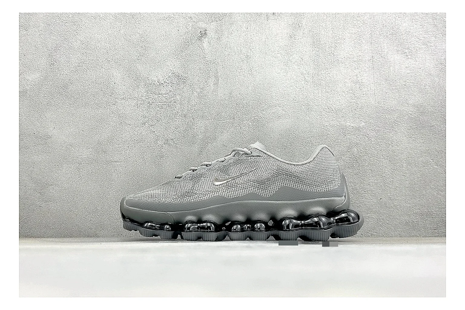 Nike Air Liquid Metal Silver QC reference image showing reflective silver upper, running-inspired panels, sculpted pod outsole, and glossy tech finish