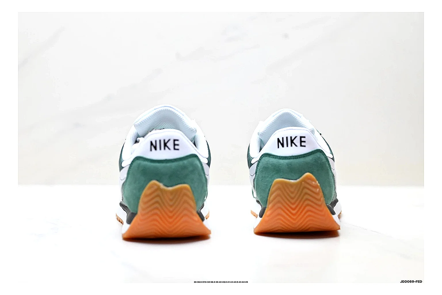 Nike Cortez Green White QC reference photo showing green white leather low-top upper, slim retro runner profile, Swoosh detail, and classic Cortez sole