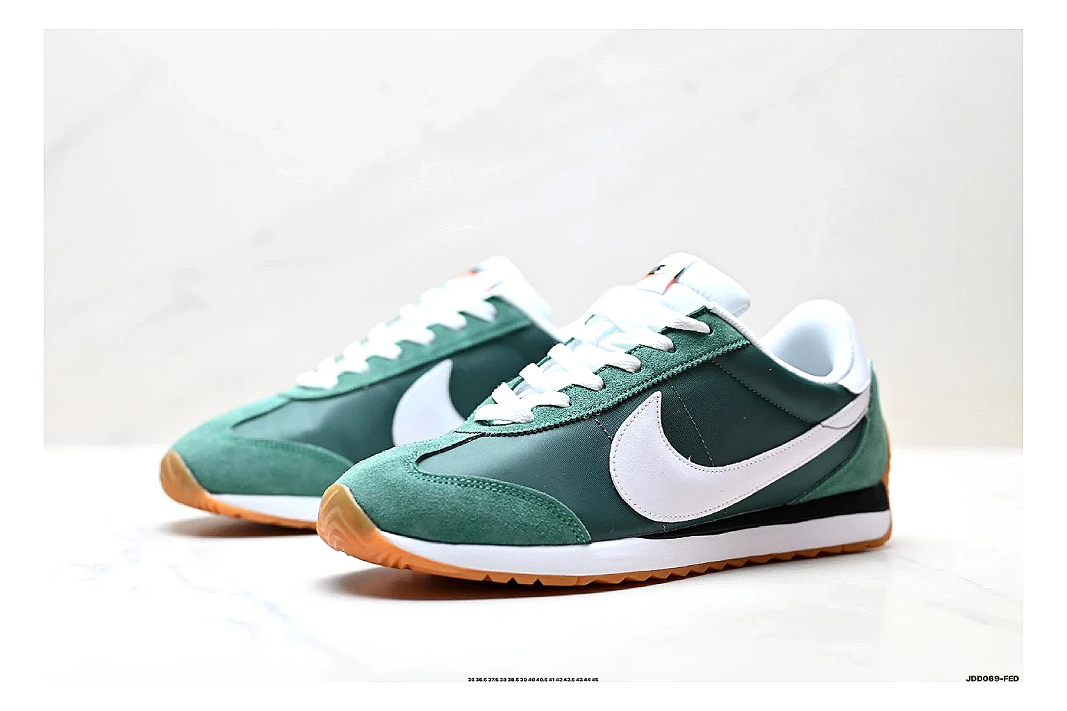 Nike Cortez Green White QC reference photo showing green white leather low-top upper, slim retro runner profile, Swoosh detail, and classic Cortez sole thumbnail 3