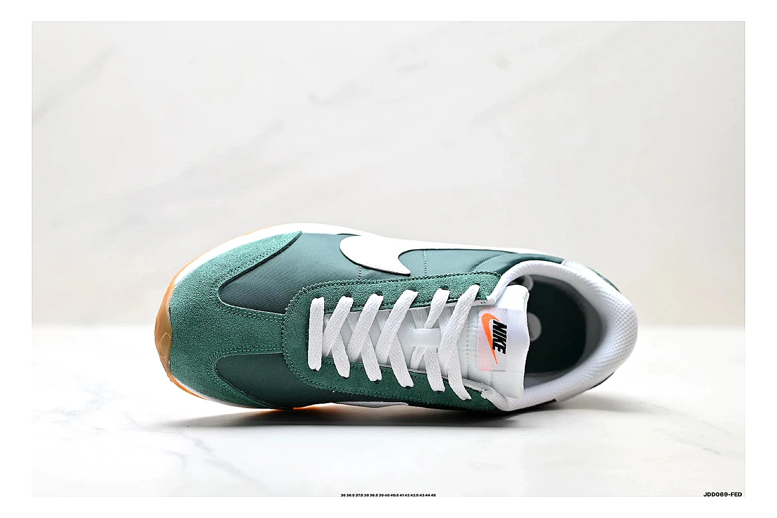 Nike Cortez Green White QC reference photo showing green white leather low-top upper, slim retro runner profile, Swoosh detail, and classic Cortez sole thumbnail 5