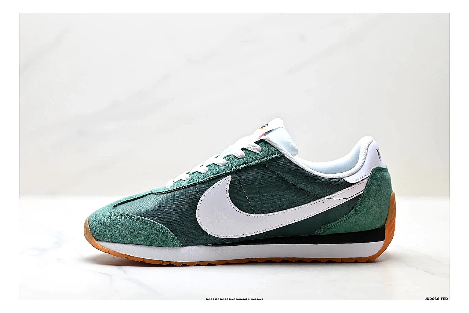 Nike Cortez Green White QC reference photo showing green white leather low-top upper, slim retro runner profile, Swoosh detail, and classic Cortez sole thumbnail 6