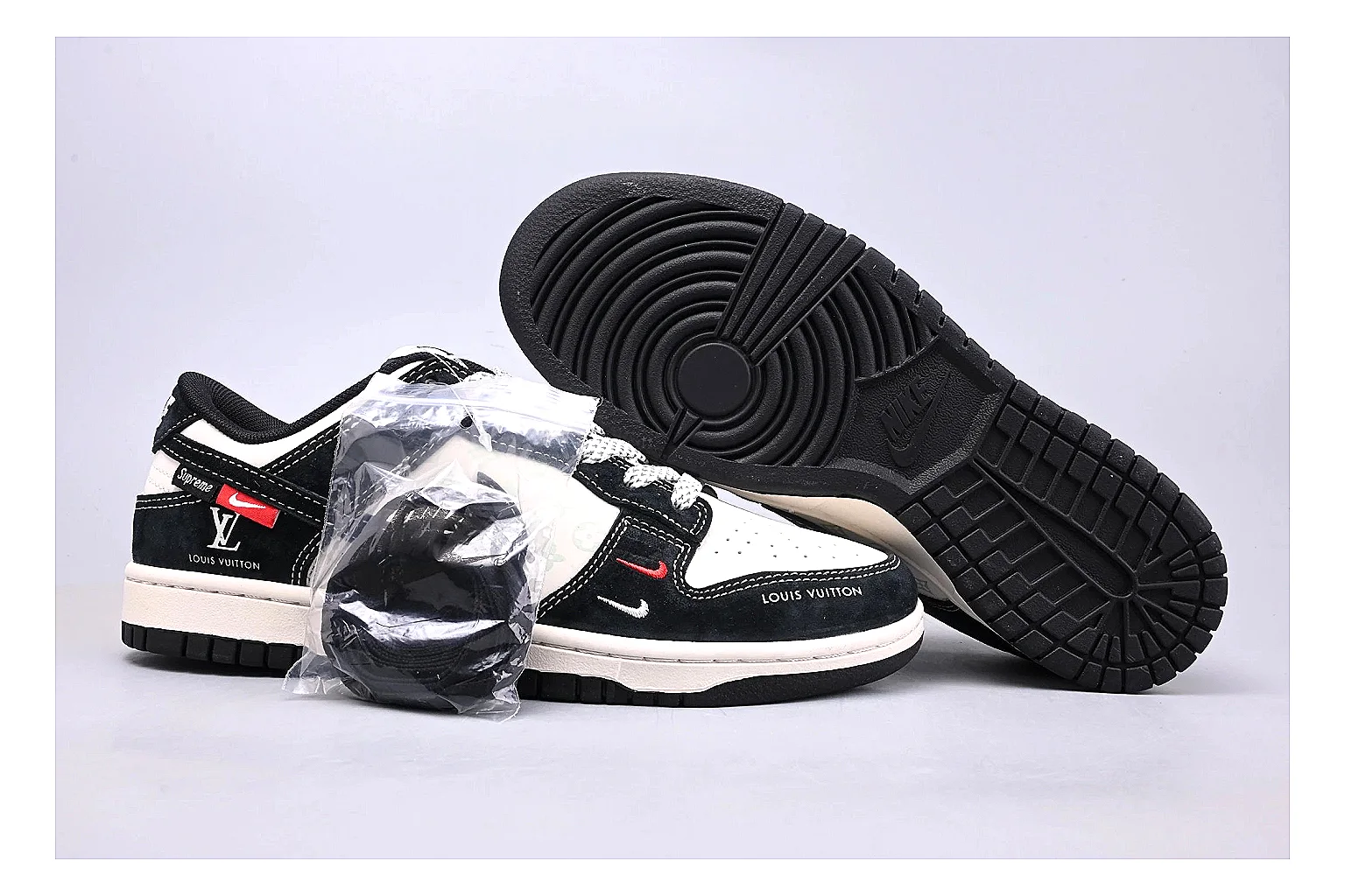 Nike Dunk Low Black White QC reference photo showing black and white leather panels, low Dunk silhouette, padded collar, and basketball-retro sole