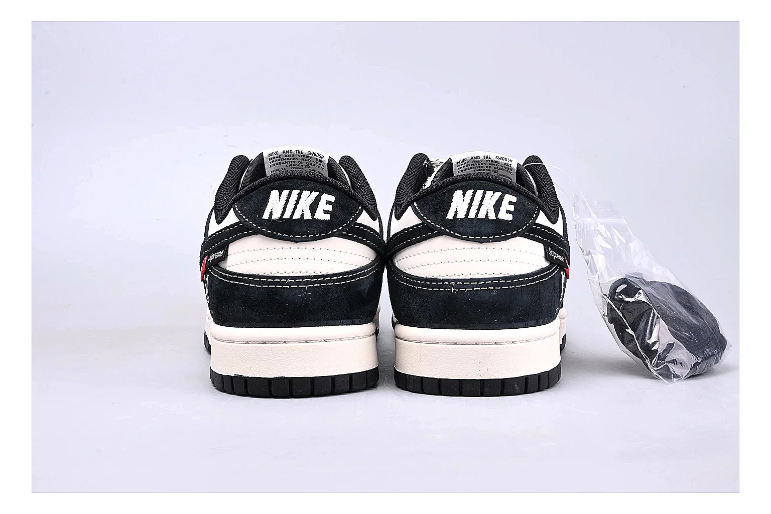 Nike Dunk Low Black White QC reference photo showing black and white leather panels, low Dunk silhouette, padded collar, and basketball-retro sole thumbnail 3