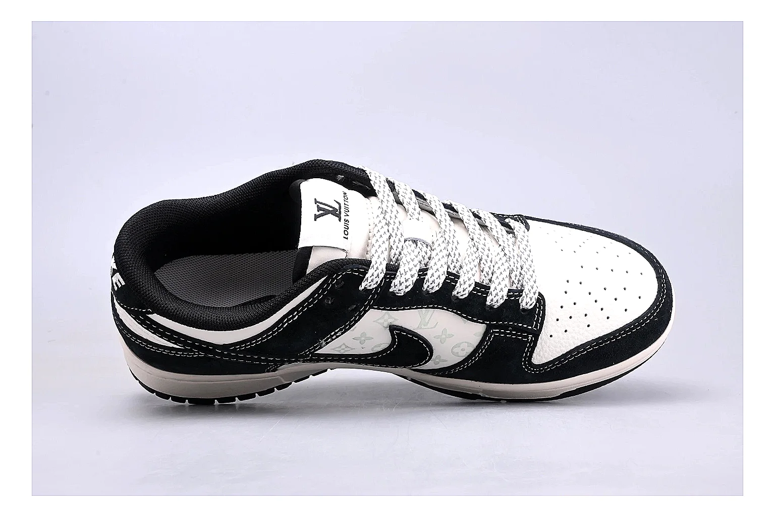 Nike Dunk Low Black White QC reference photo showing black and white leather panels, low Dunk silhouette, padded collar, and basketball-retro sole thumbnail 6