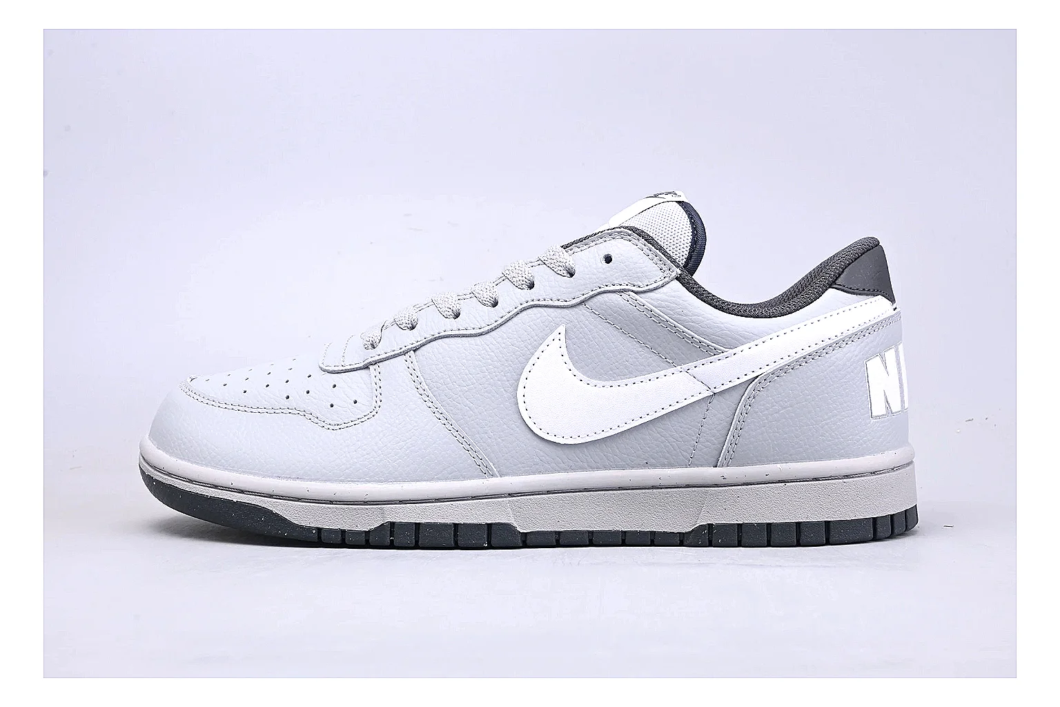Nike Dunk Low White Gray QC reference photo showing white and gray leather panels, low Dunk shape, padded collar, and basketball-retro sole