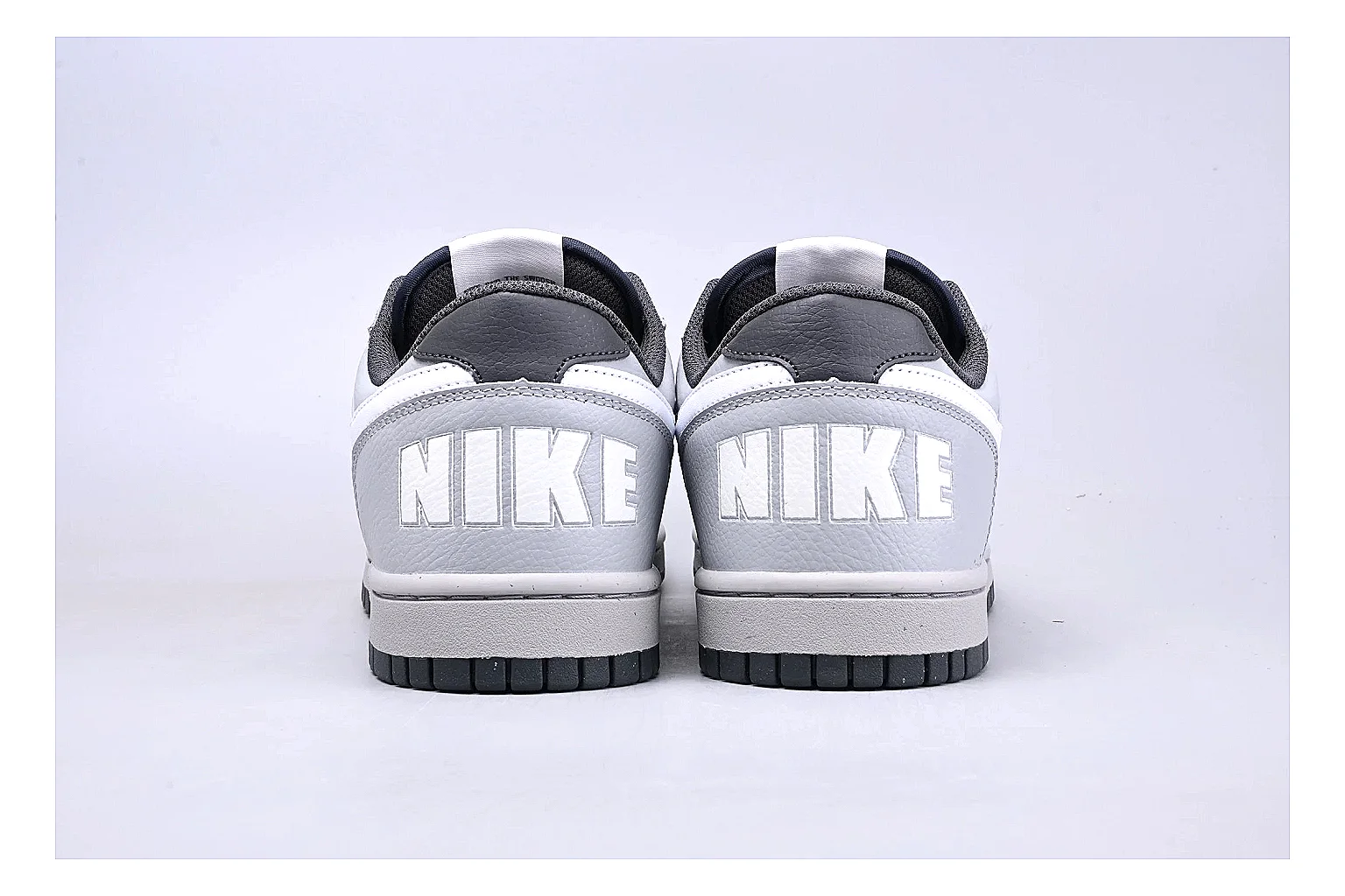Nike Dunk Low White Gray QC reference photo showing white and gray leather panels, low Dunk shape, padded collar, and basketball-retro sole thumbnail 3