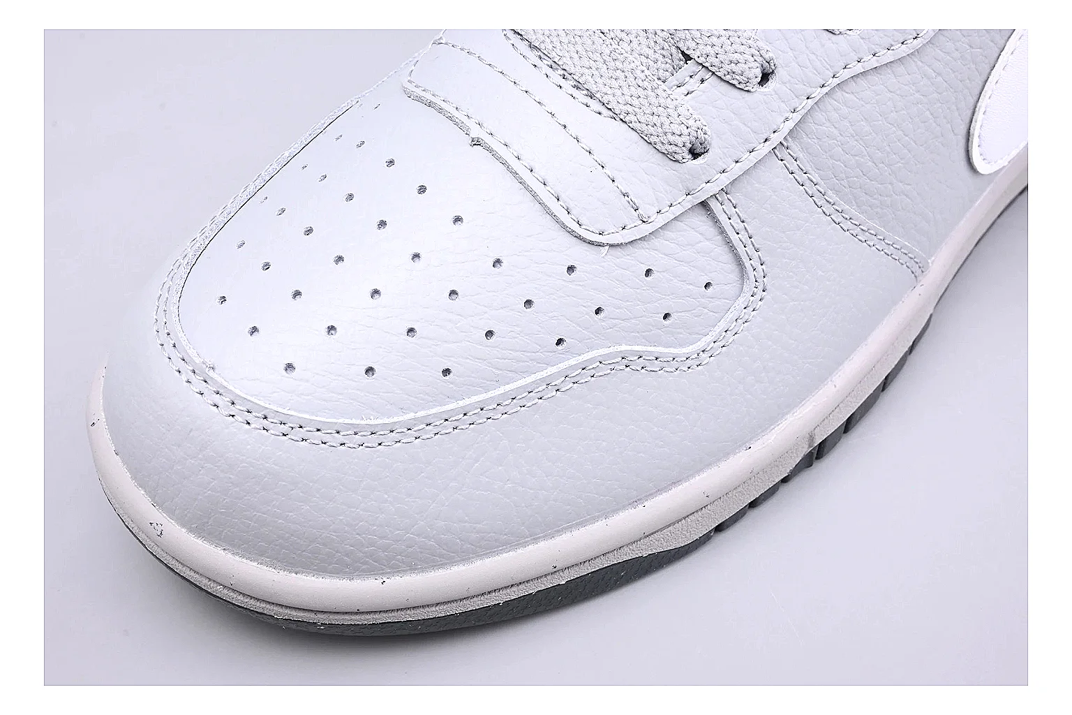 Nike Dunk Low White Gray QC reference photo showing white and gray leather panels, low Dunk shape, padded collar, and basketball-retro sole thumbnail 4
