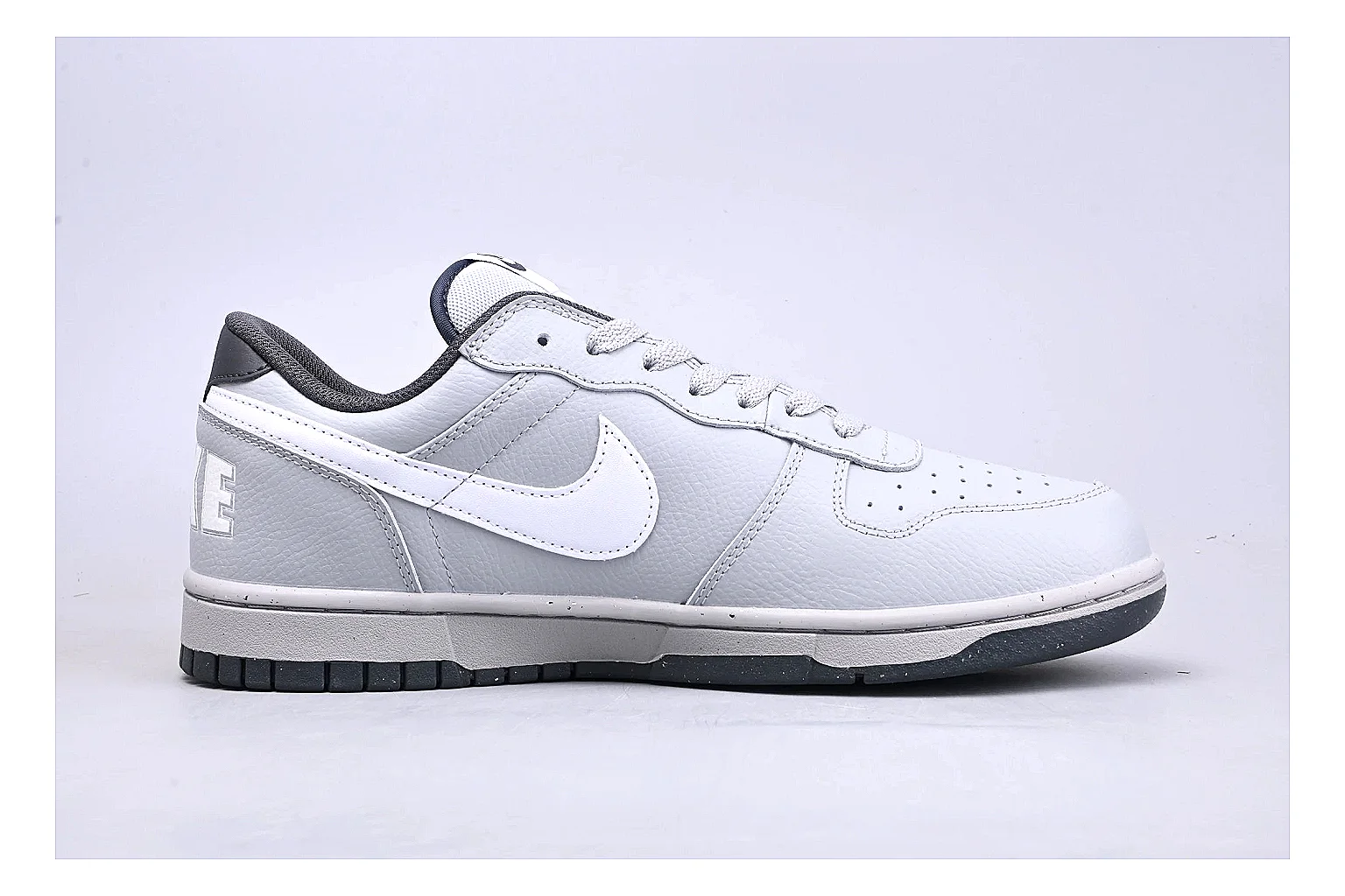 Nike Dunk Low White Gray QC reference photo showing white and gray leather panels, low Dunk shape, padded collar, and basketball-retro sole thumbnail 5