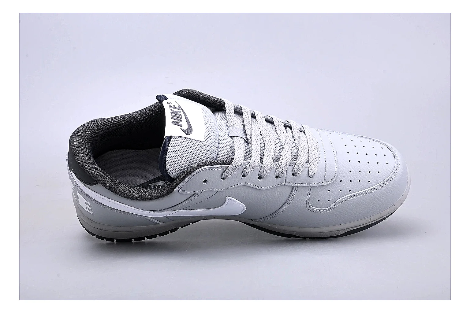 Nike Dunk Low White Gray QC reference photo showing white and gray leather panels, low Dunk shape, padded collar, and basketball-retro sole thumbnail 6