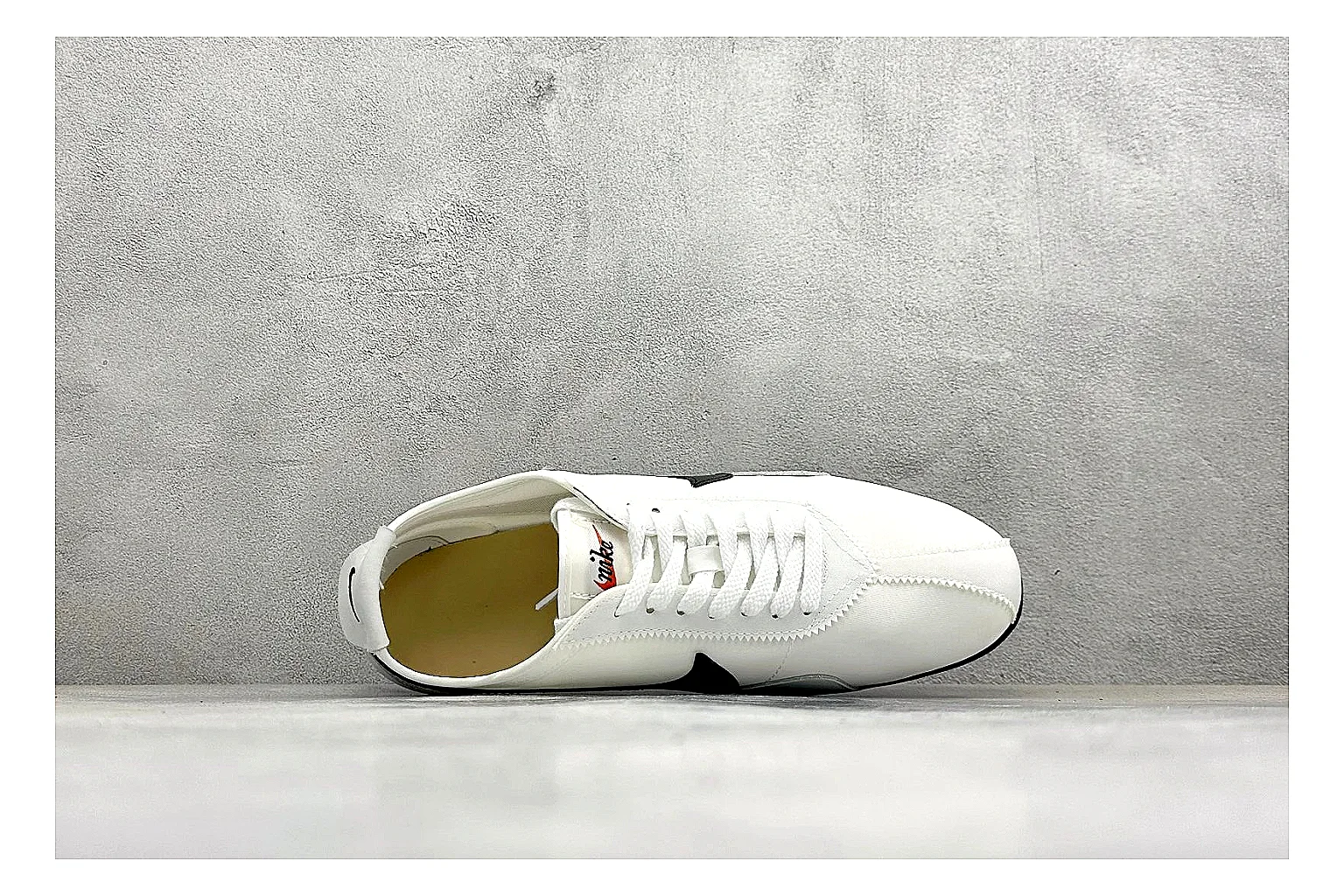 Nike Moon Shoe OG White Black QC reference image showing white upper, black Swoosh, slim retro runner shape, and waffle-style outsole thumbnail 6