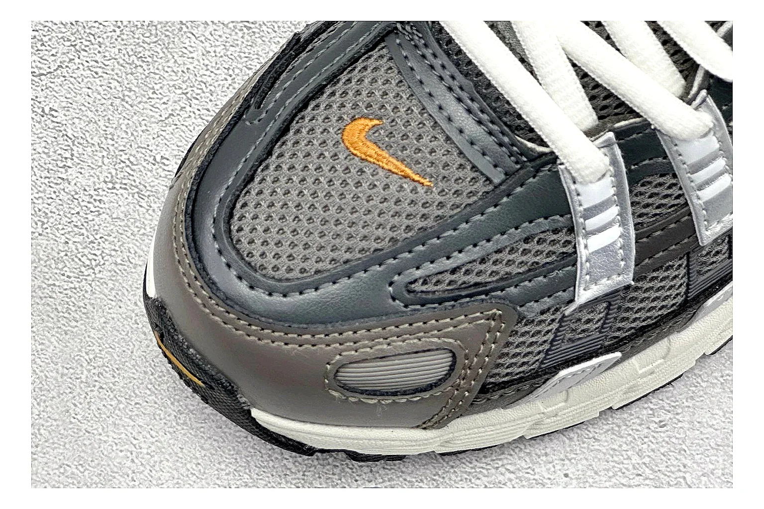 Nike P-6000 Black Orange QC reference photo showing black layered runner upper, orange accent hits, retro P-6000 paneling, and cushioned casual sole thumbnail 4