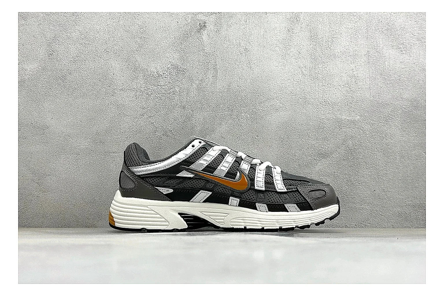 Nike P-6000 Black Orange QC reference photo showing black layered runner upper, orange accent hits, retro P-6000 paneling, and cushioned casual sole thumbnail 5