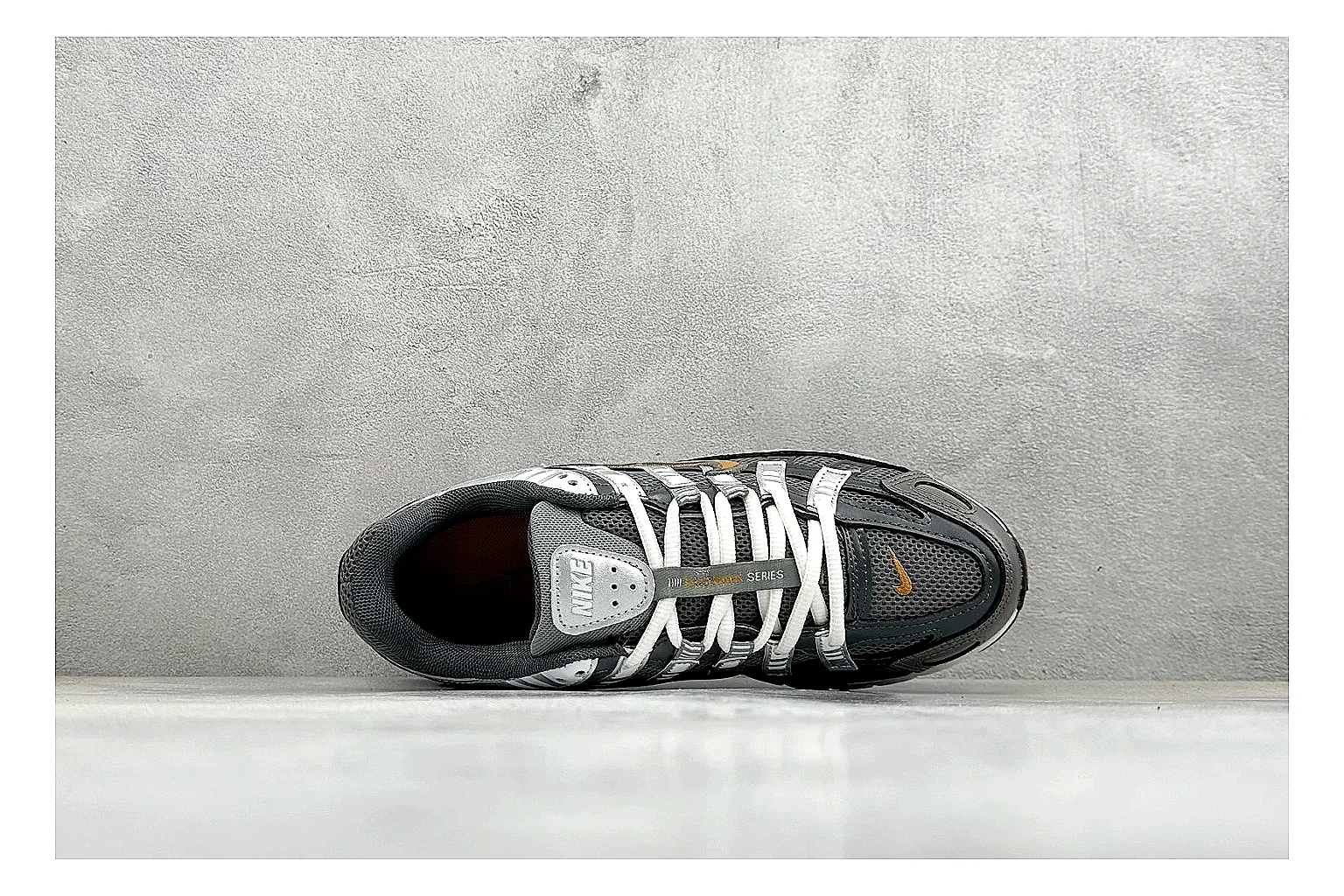 Nike P-6000 Black Orange QC reference photo showing black layered runner upper, orange accent hits, retro P-6000 paneling, and cushioned casual sole thumbnail 6