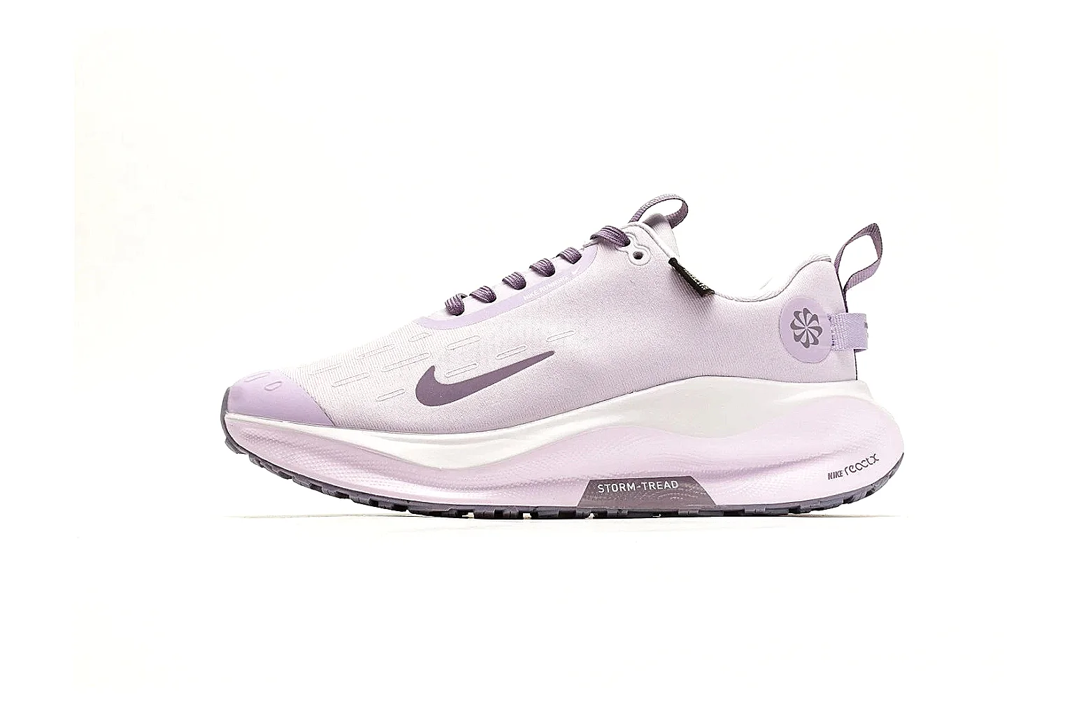 Nike ReactX GORE-TEX Lilac Sneakers QC reference photo showing lilac textile upper, small Swoosh, heel pull tabs, cushioned ReactX-style sole, and weather-ready low profile