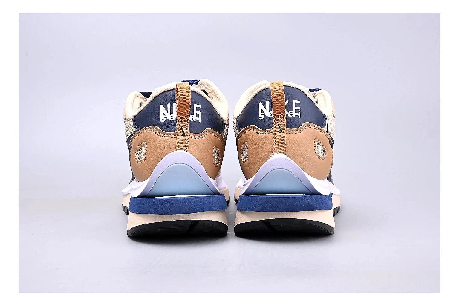 Nike Retro Runner Beige Blue QC reference photo showing beige suede-mesh runner upper, blue accent panels, low retro profile, and cushioned running sole thumbnail 3